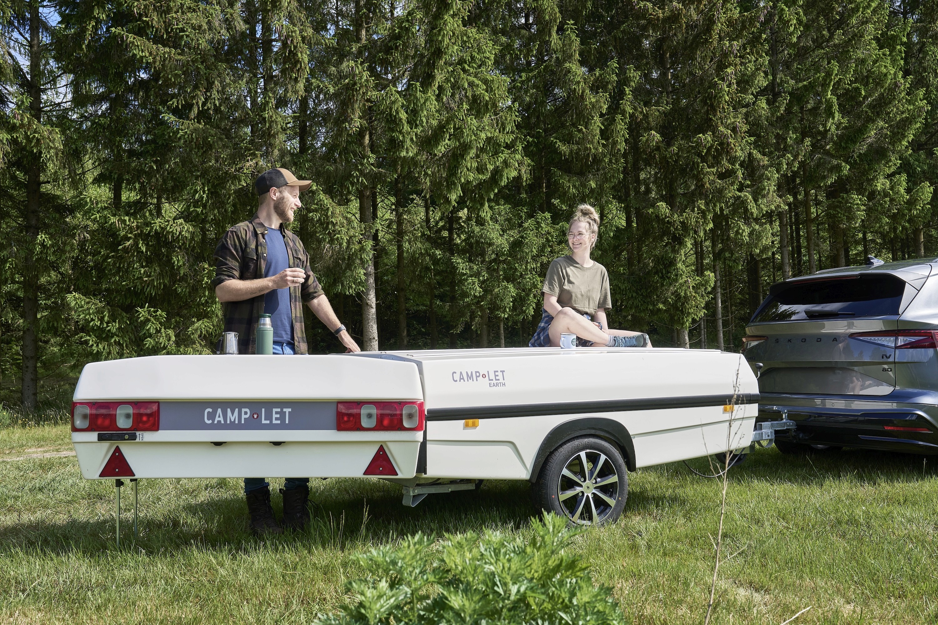 Camp-let Earth with people drinking coffee