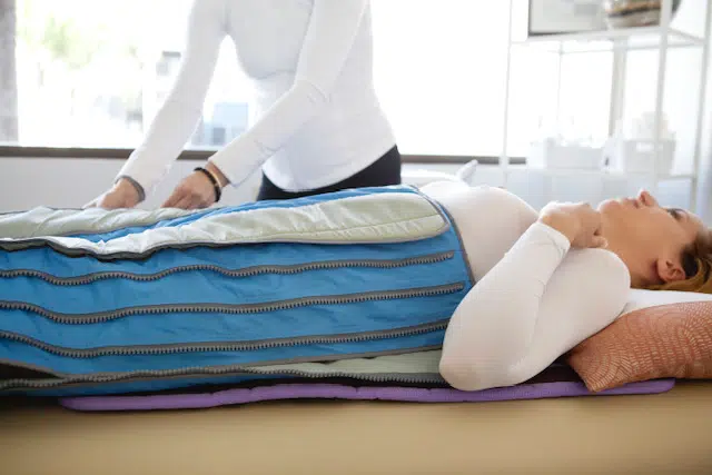 two ladies looking at a laptop and smiling