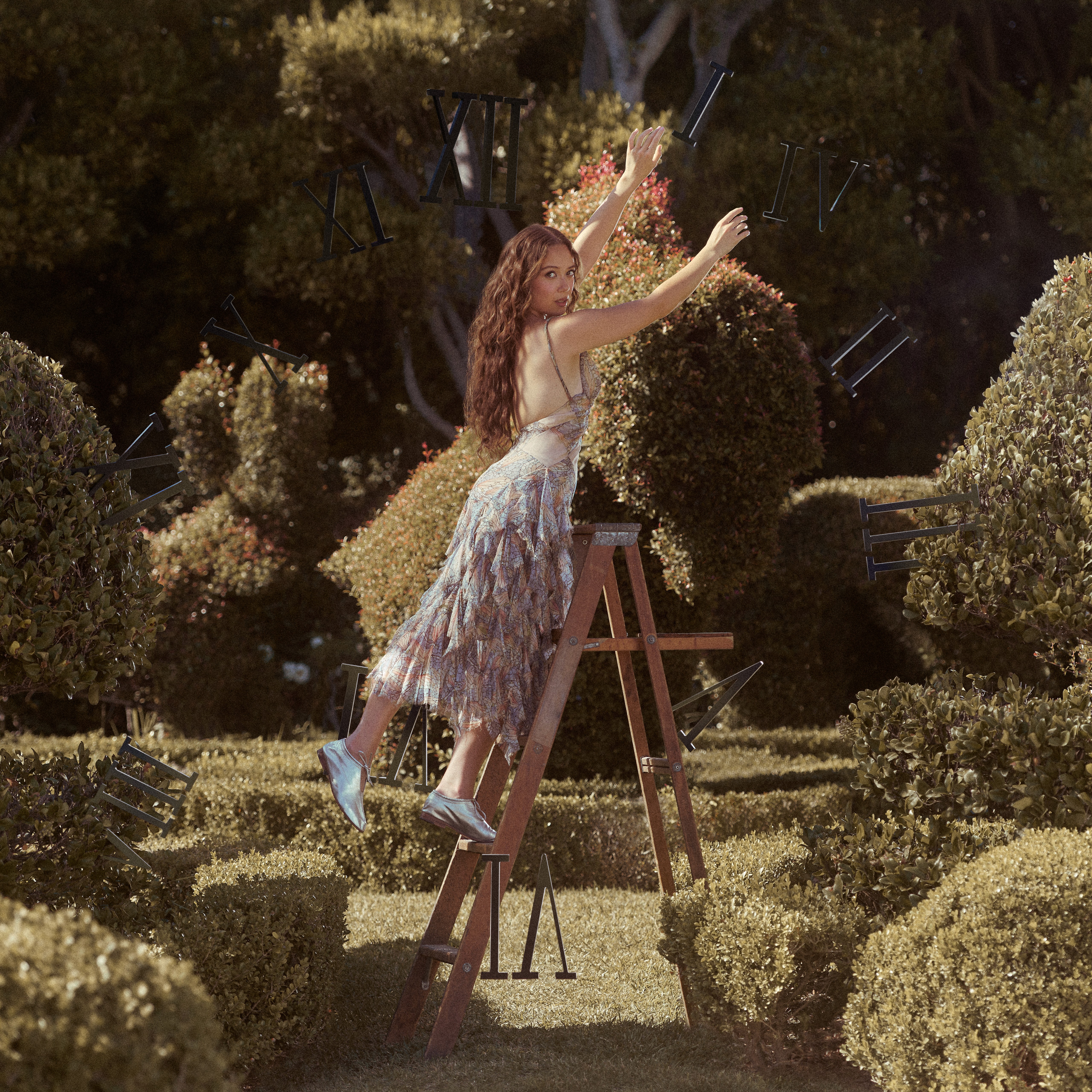 Singer-songwriter performs with a red electric guitar at Iceland Airwaves 2022 inside Fríkirkjan Church in Reykjavík, illuminated by purple and pink stage lighting.