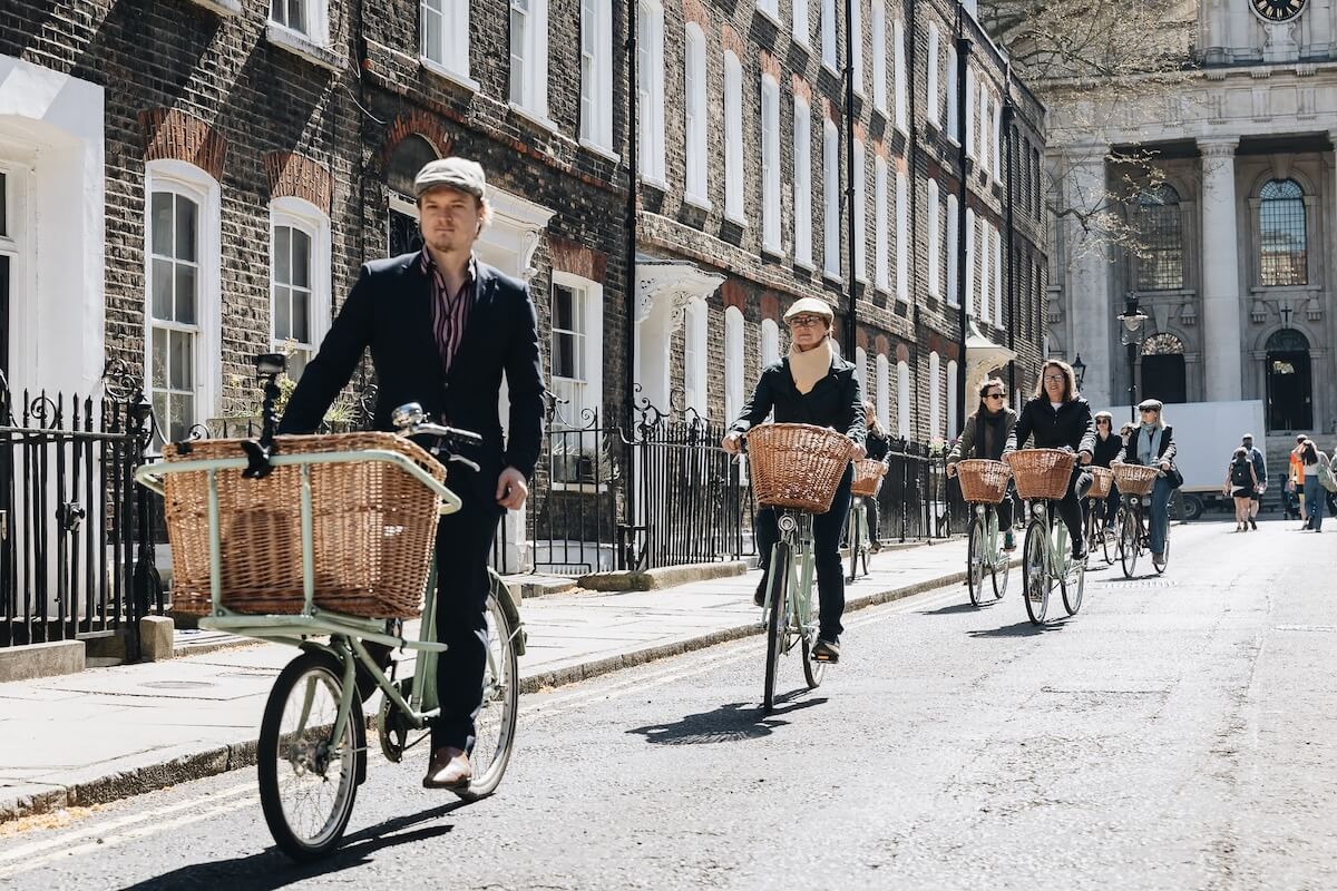 A group of cyclists exploring Westminster on a Tally Ho London bike tour 