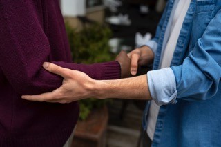 Two people are holding hands
