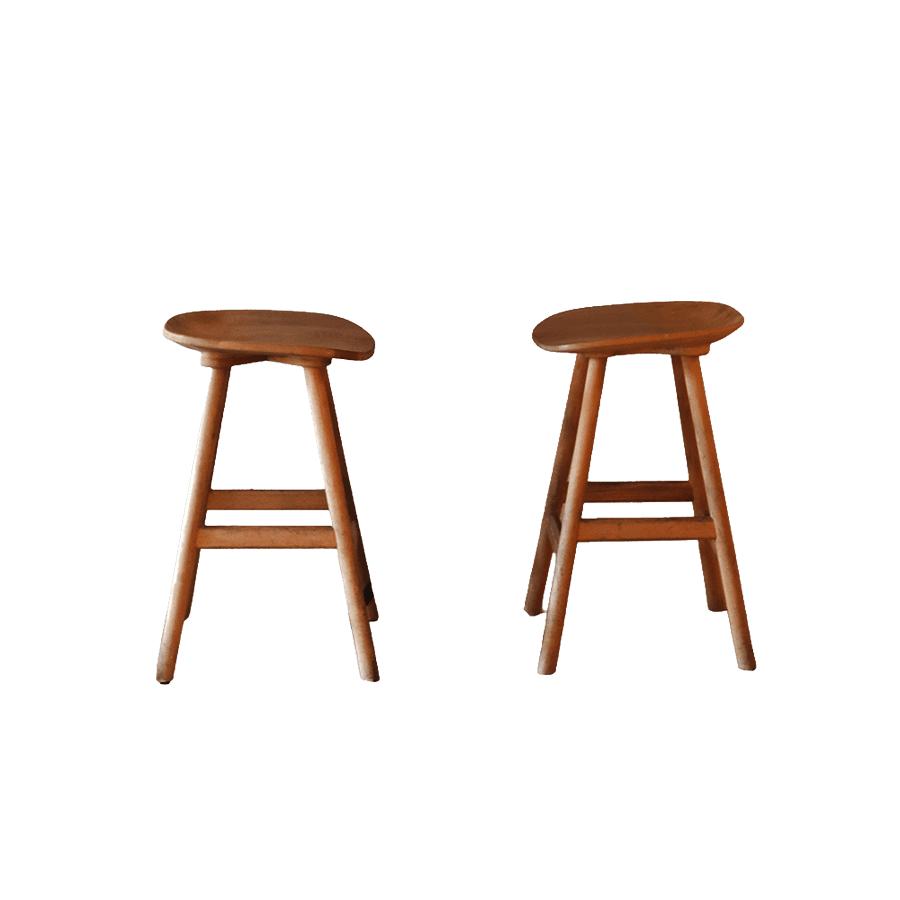 Two wooden bar stools placed side by side