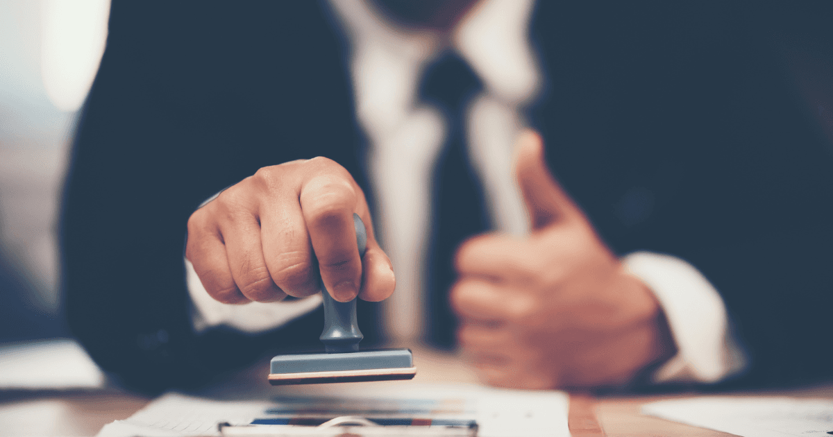 Legal documents with a stamp of approval, symbolizing expertise in procuring necessary immigration waivers.