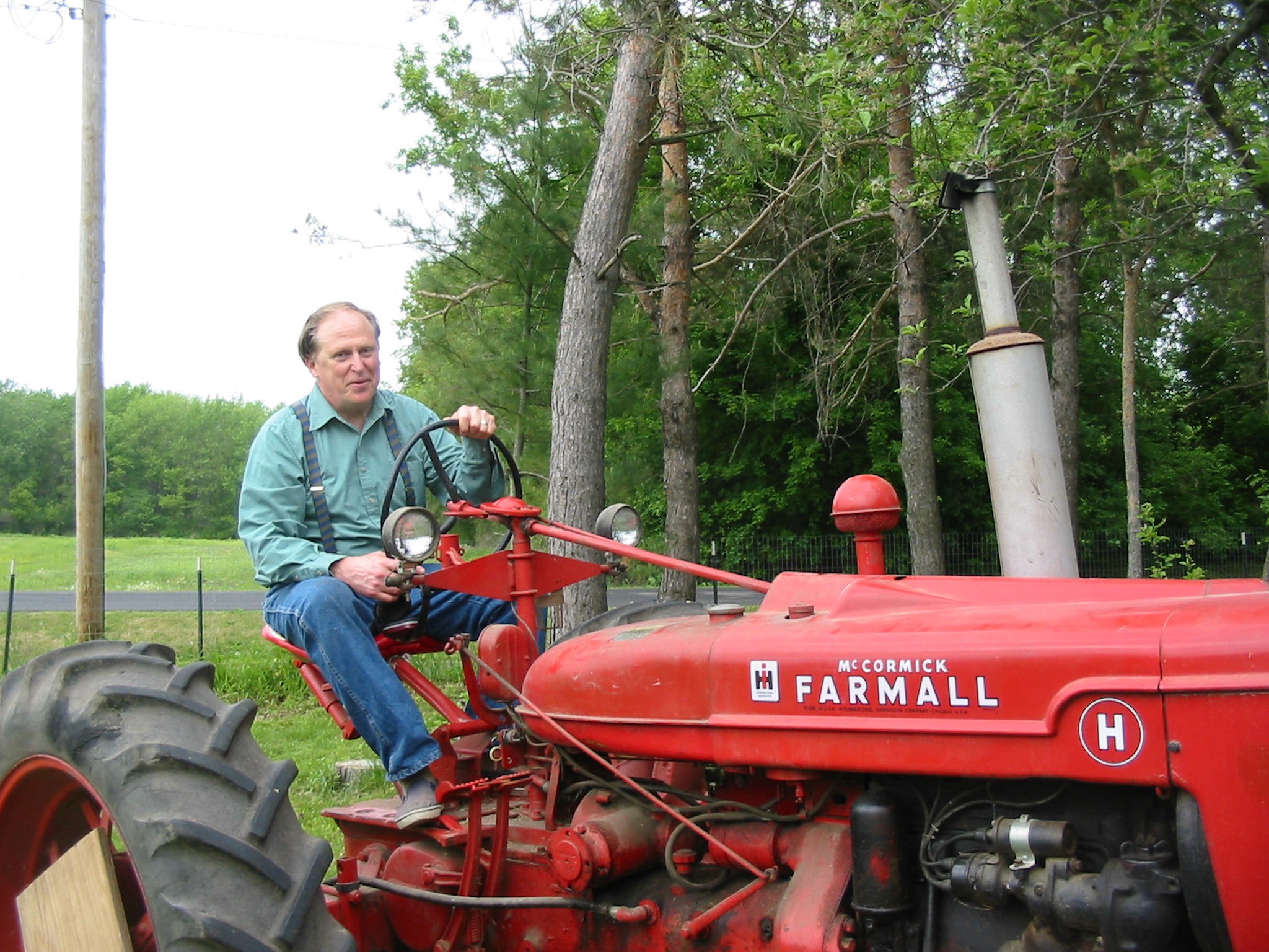 Scott Summers sitting on his 1942 Farmall H