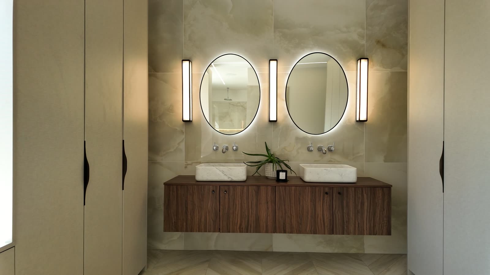 Slow dolly through a luxury bathroom in stone and walnut