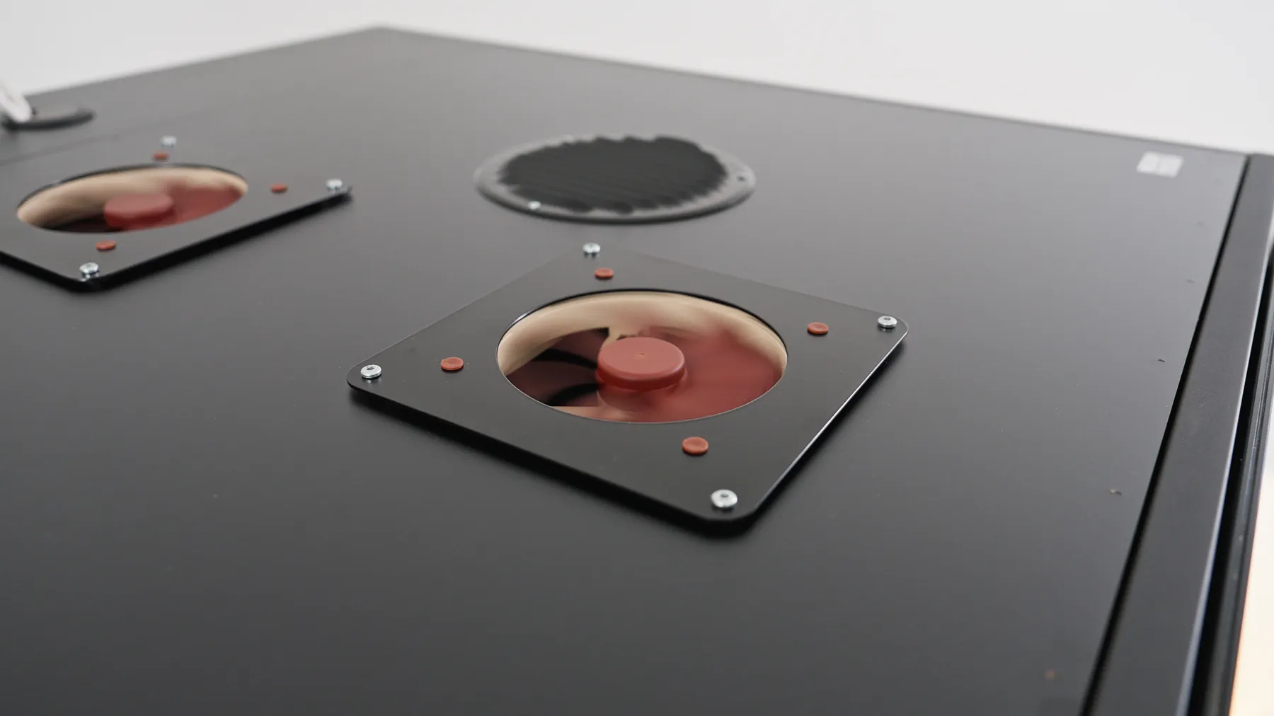 Close-up of ventilation fans mounted on a pod's black ceiling panel
