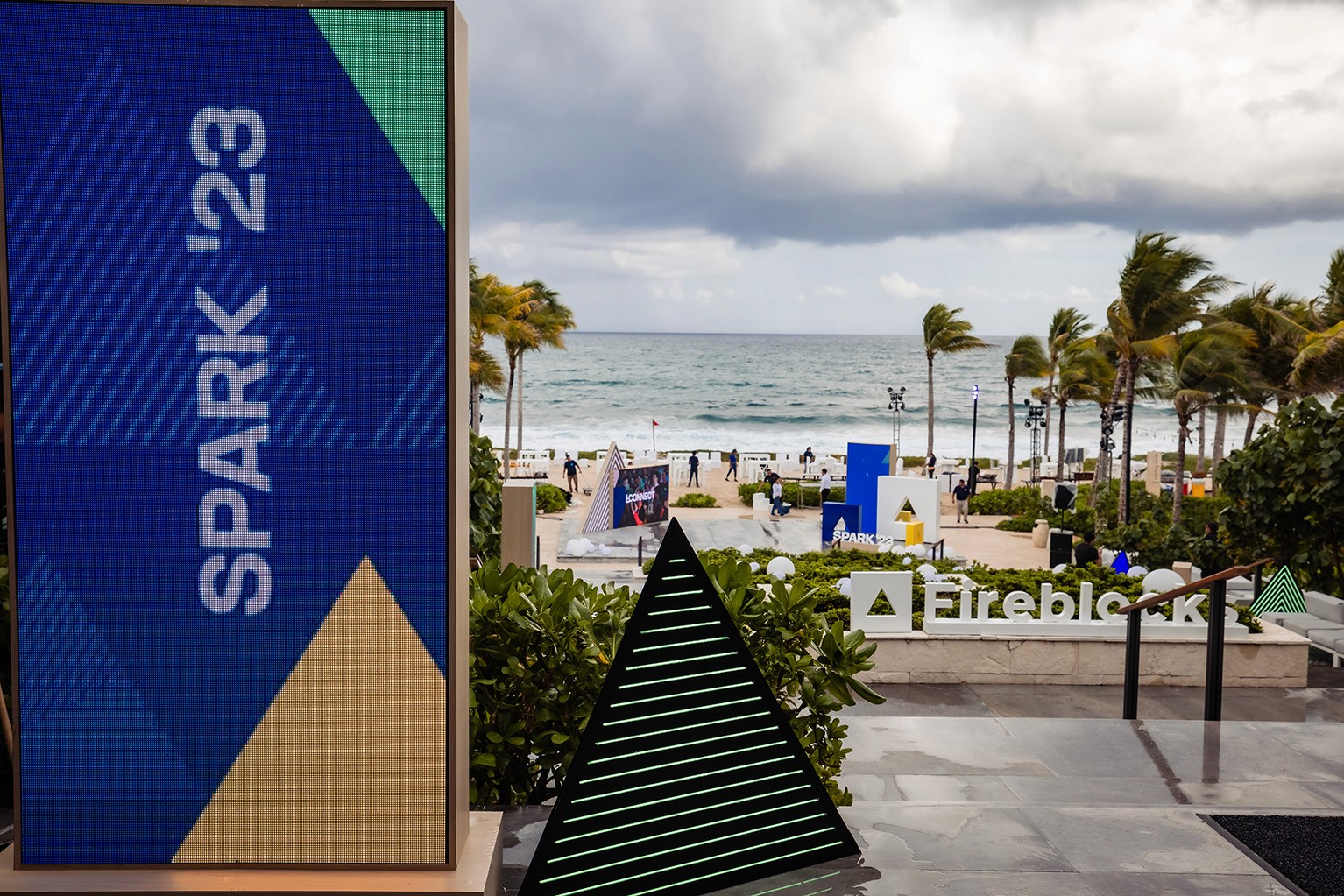 Photo of an outdoor screen and decorations with SPARK branding.