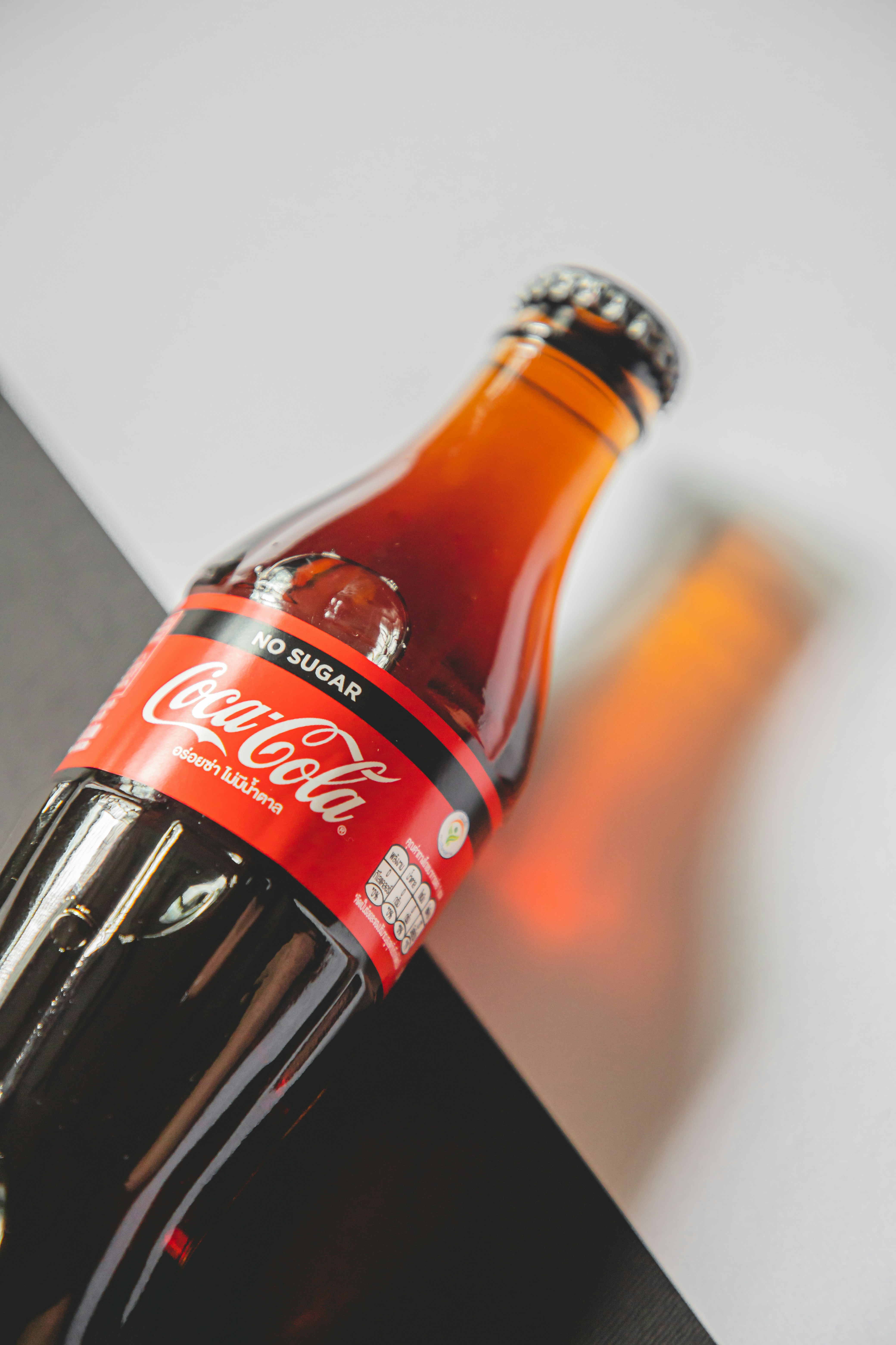 coca cola bottle on white table
