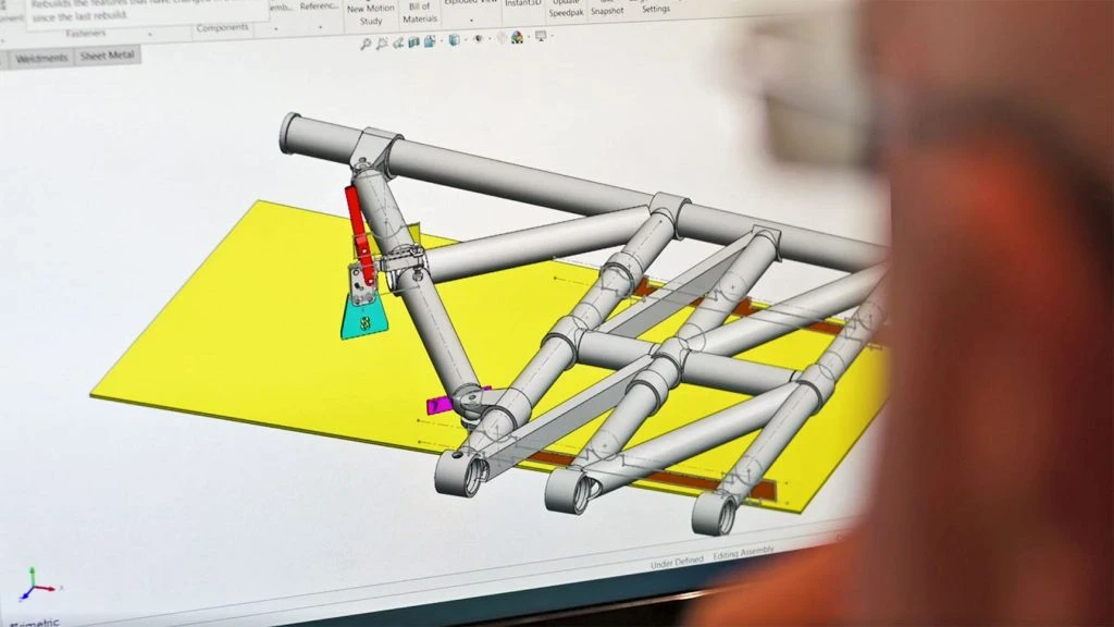 CAD model showing component nesting and production layout for manufacturing.