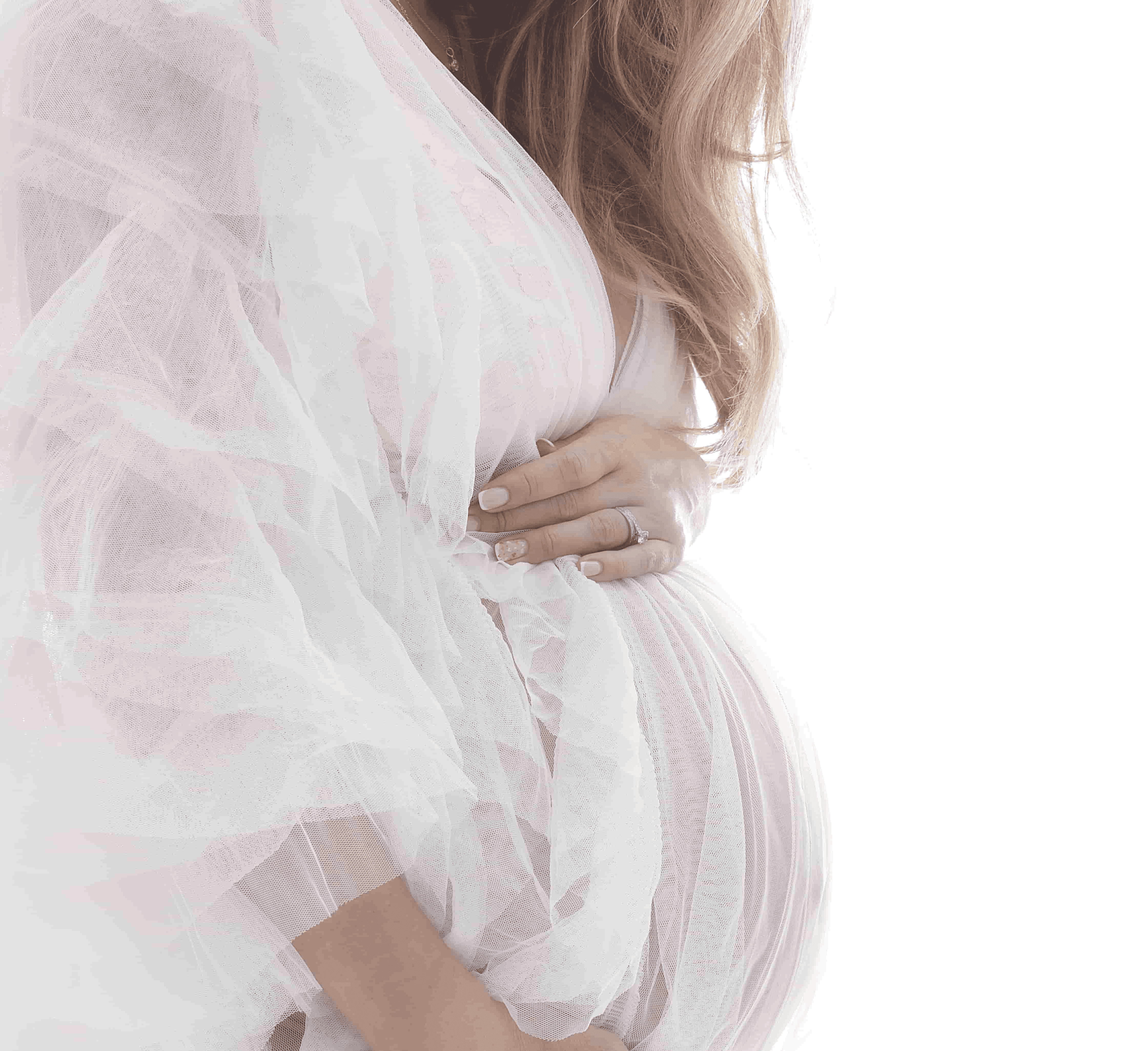 An expectant mum posing as part of a family maternity photoshoot ideas, by Mahvin Photography in Dubai
