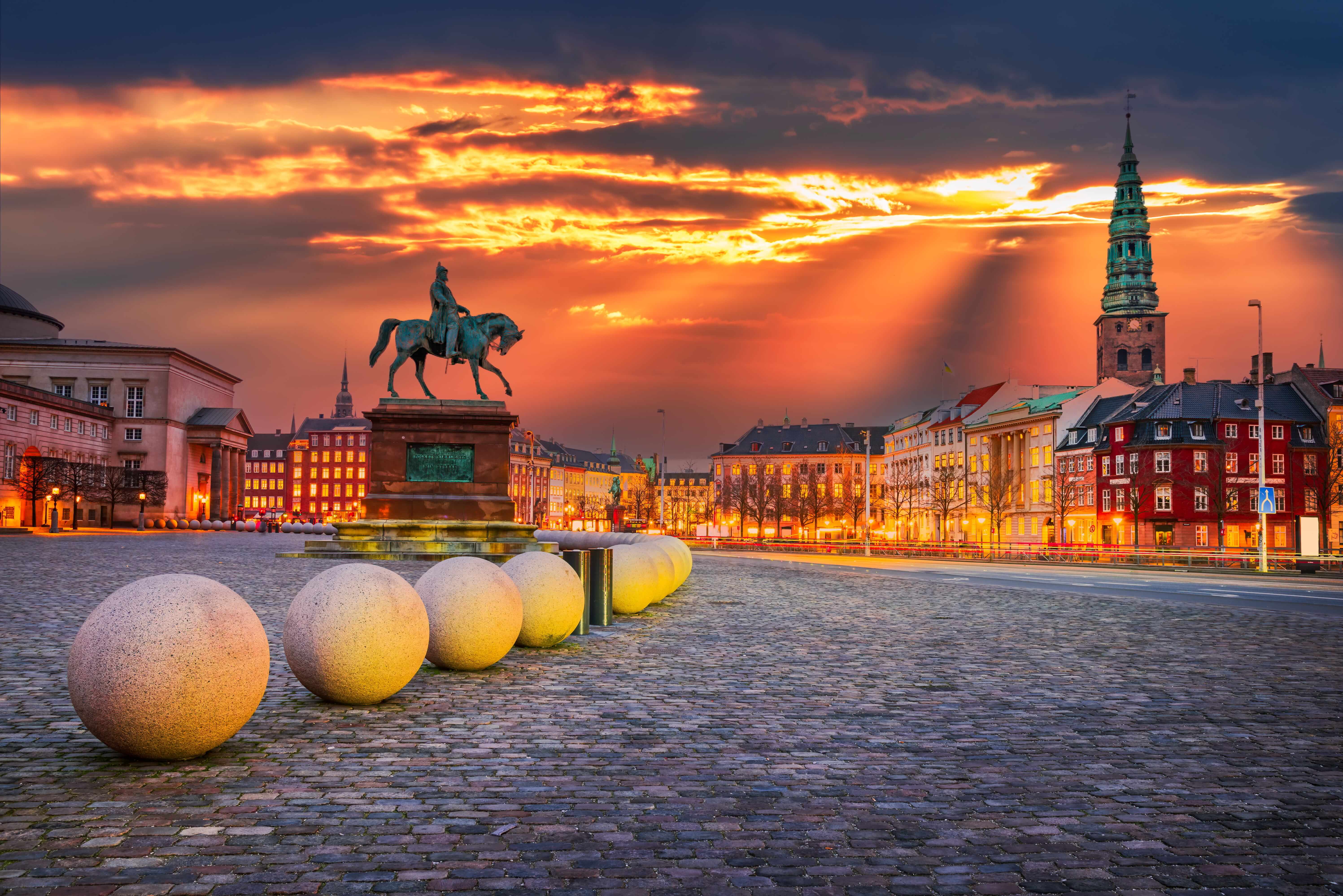 A sunset over Christiansborg Palace square in Copenhagen