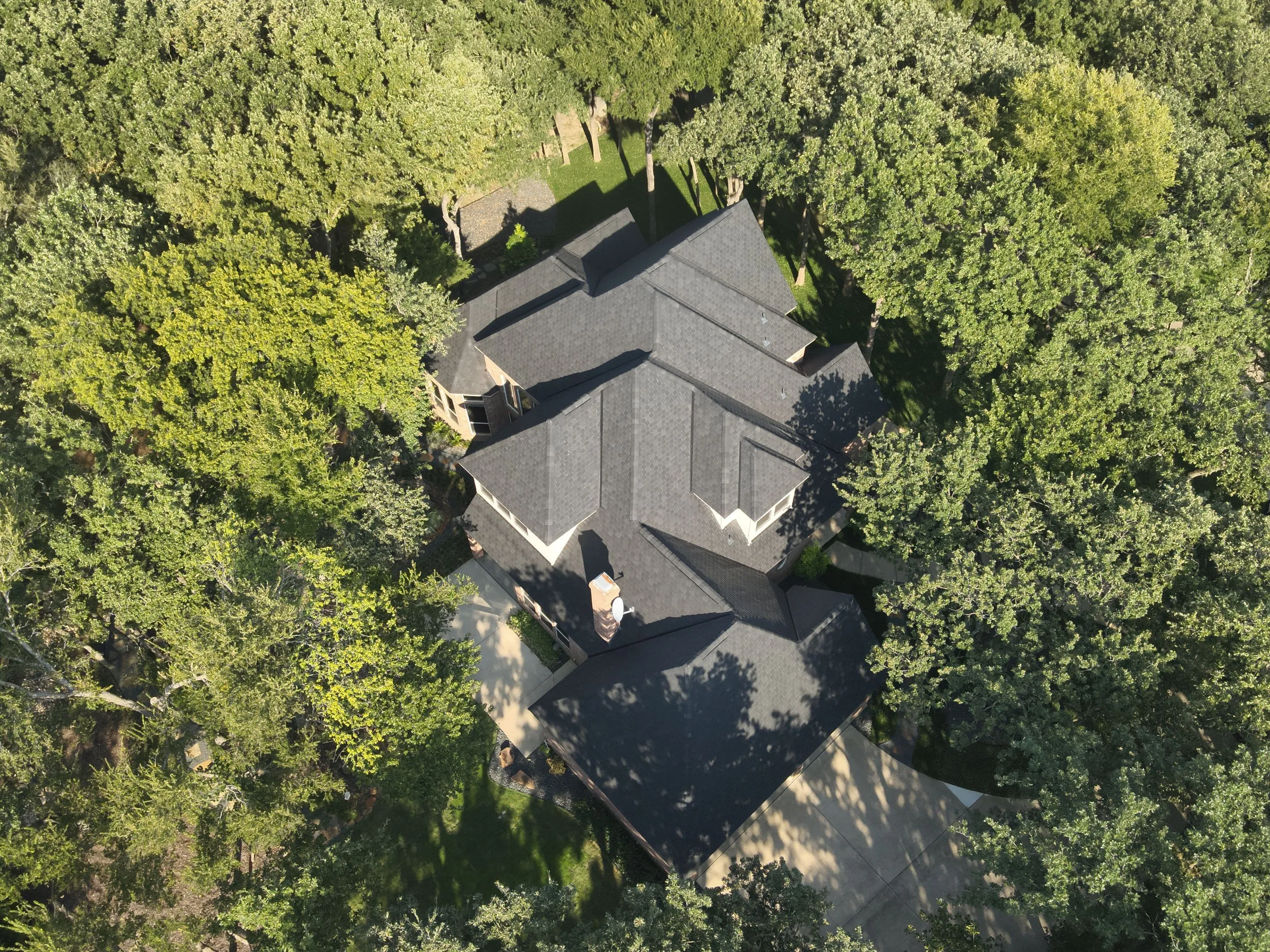 Multiple roof planes and angles on F-Wave synthetic roofing system installation in Corinth Texas neighborhood