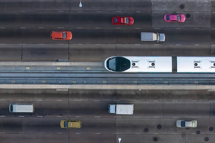Train traveling alongside road traffic, used to show responsible parties in Stockton rail accident claims