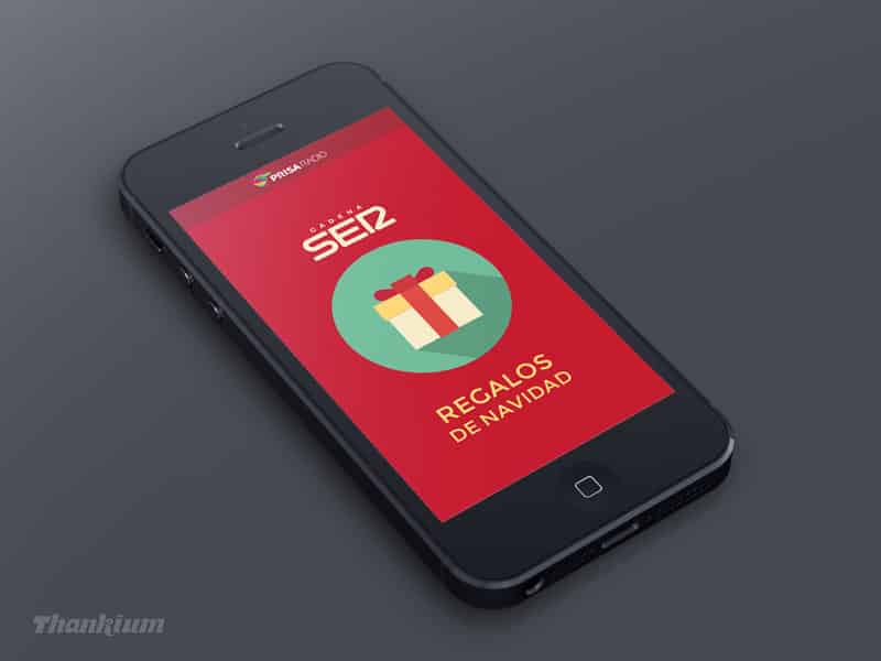 Smartphone SER con pantalla roja mostrando un regalo de Navidad y el texto "Regalos de Navidad".