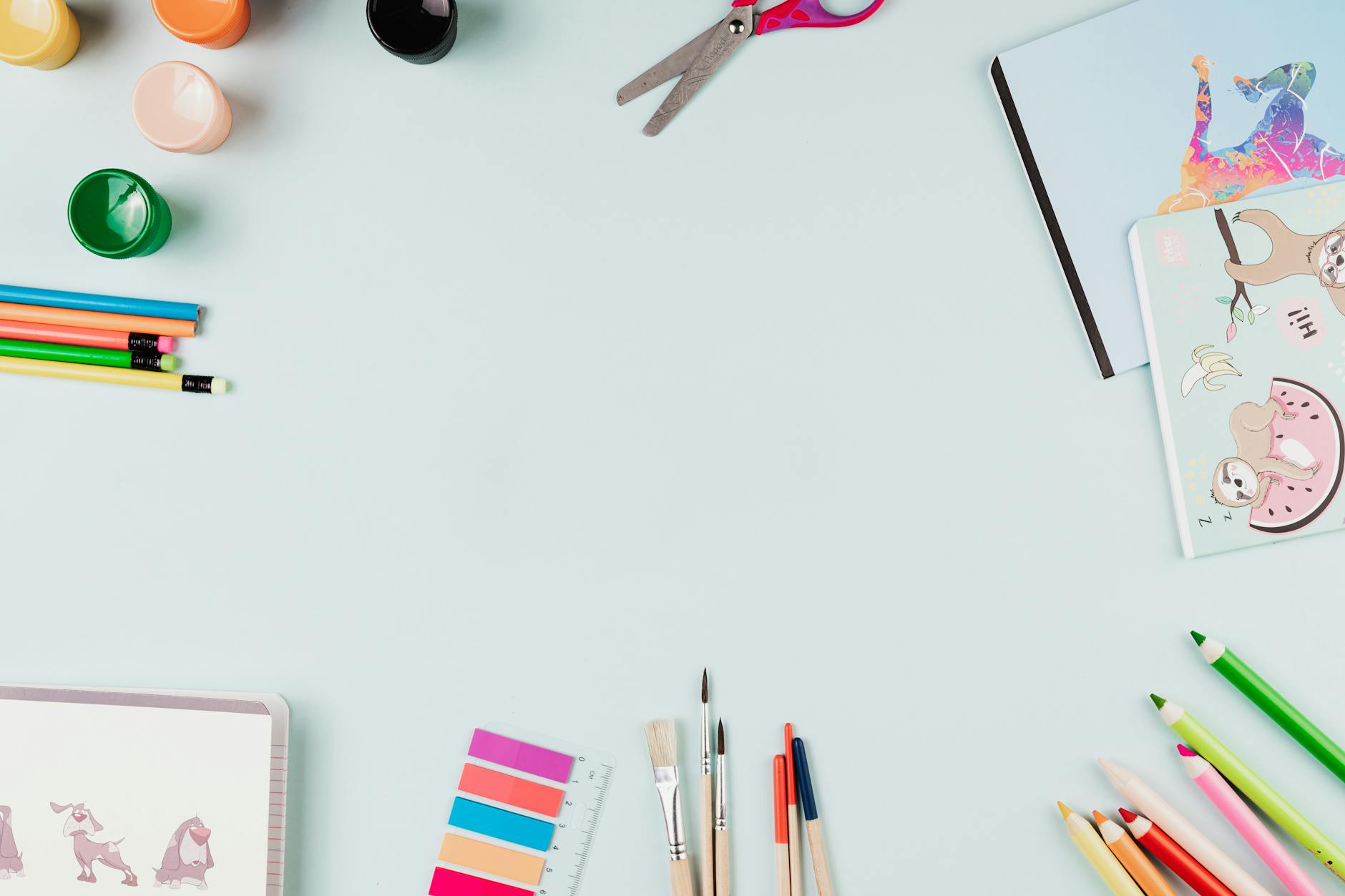 A high school student creating a 3D architectural model using colorful geometric blocks and drafting paper.