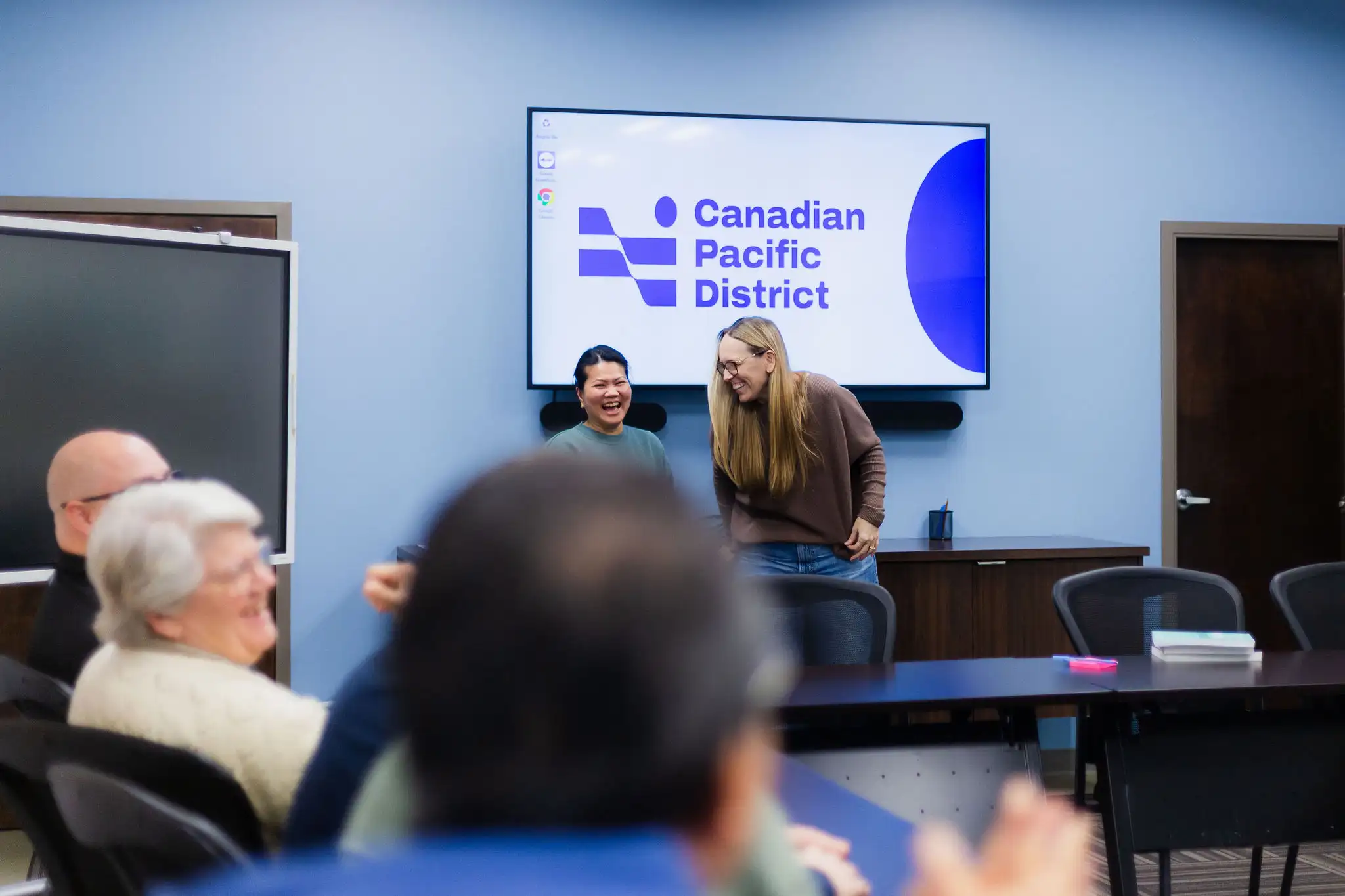 Canadian Pacific District brand photography featuring people in a professional setting brand application featured
