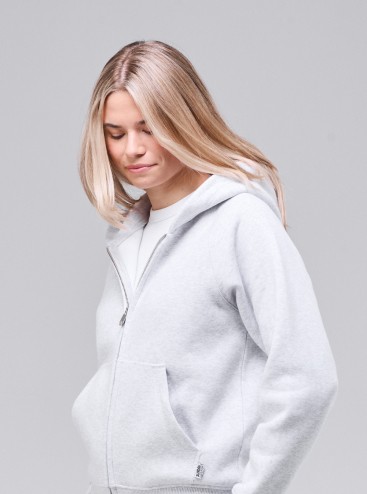 Woman wearing Sunday Superior light grey zip hoodie