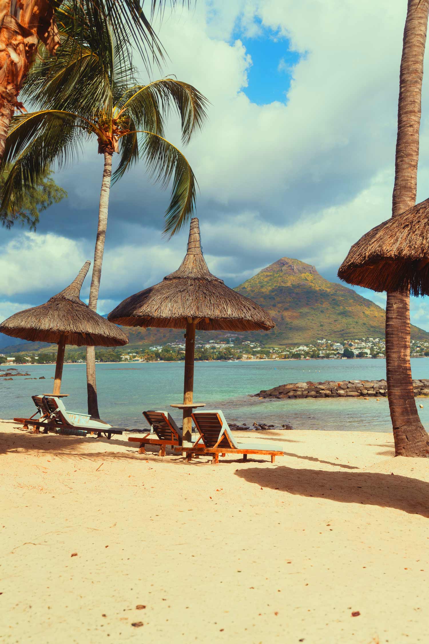 Tropical beach with loungers, filmproduction ad for a hotel in mauritius