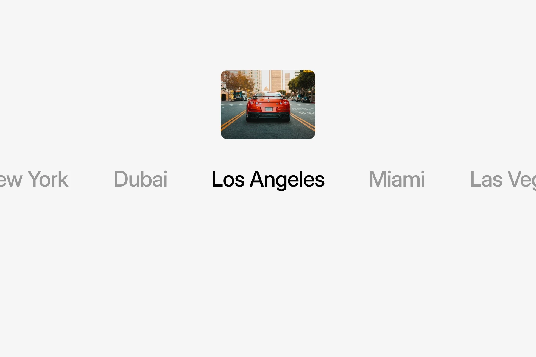 Red sports car driving through a city street representing different car rental locations such as Los Angeles, Miami, New York, Dubai, and Las Vegas.