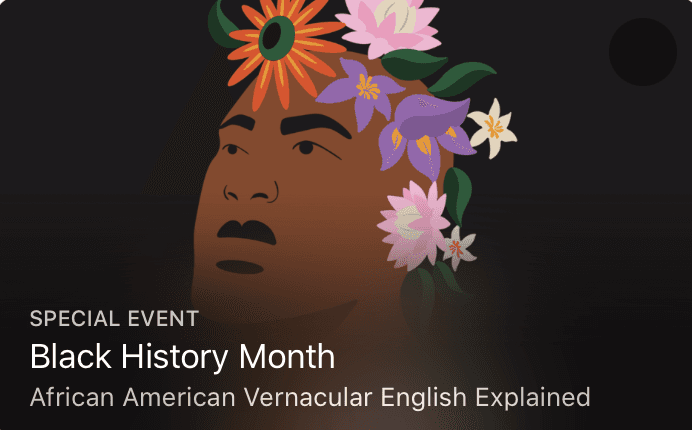 Layered blue mountains fade into a soft pink sky.