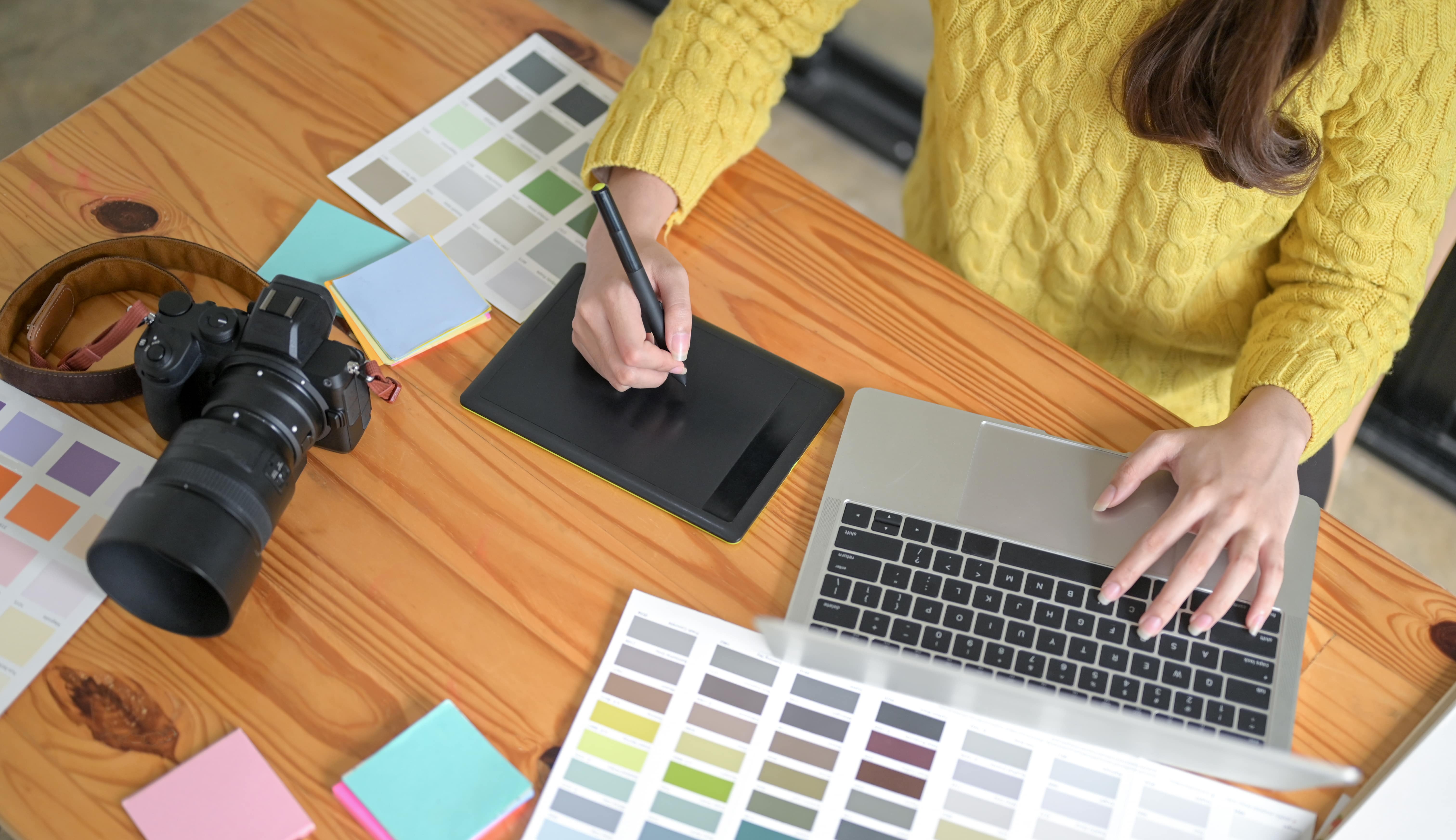 designers-are-working-on-a-drawing-tablet-and-laptop