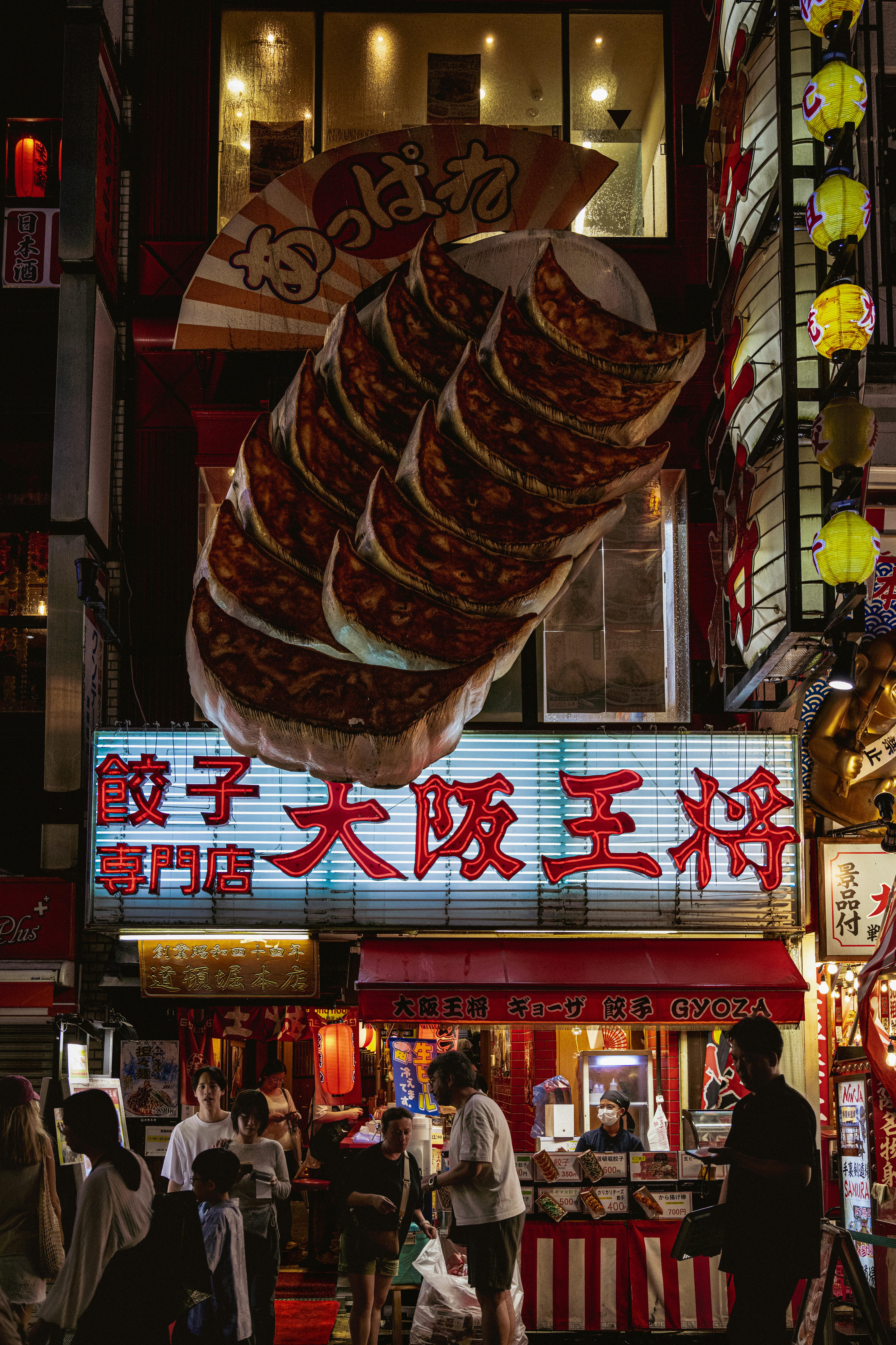a green field with a mountain in the background