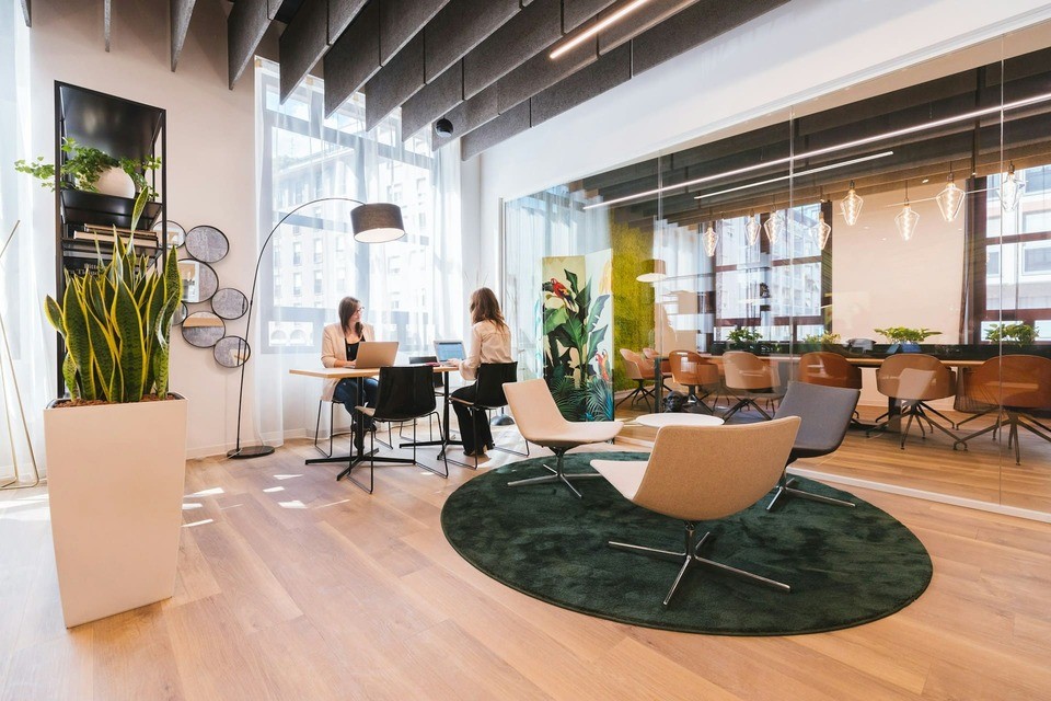Two women working in an office.