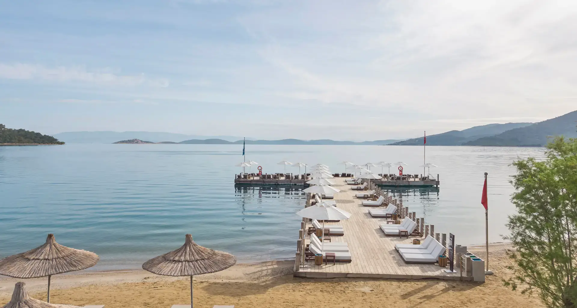 Beach, pier and parasols