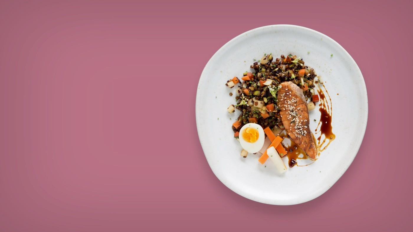 A plate of lean protein served with grains and vegetables