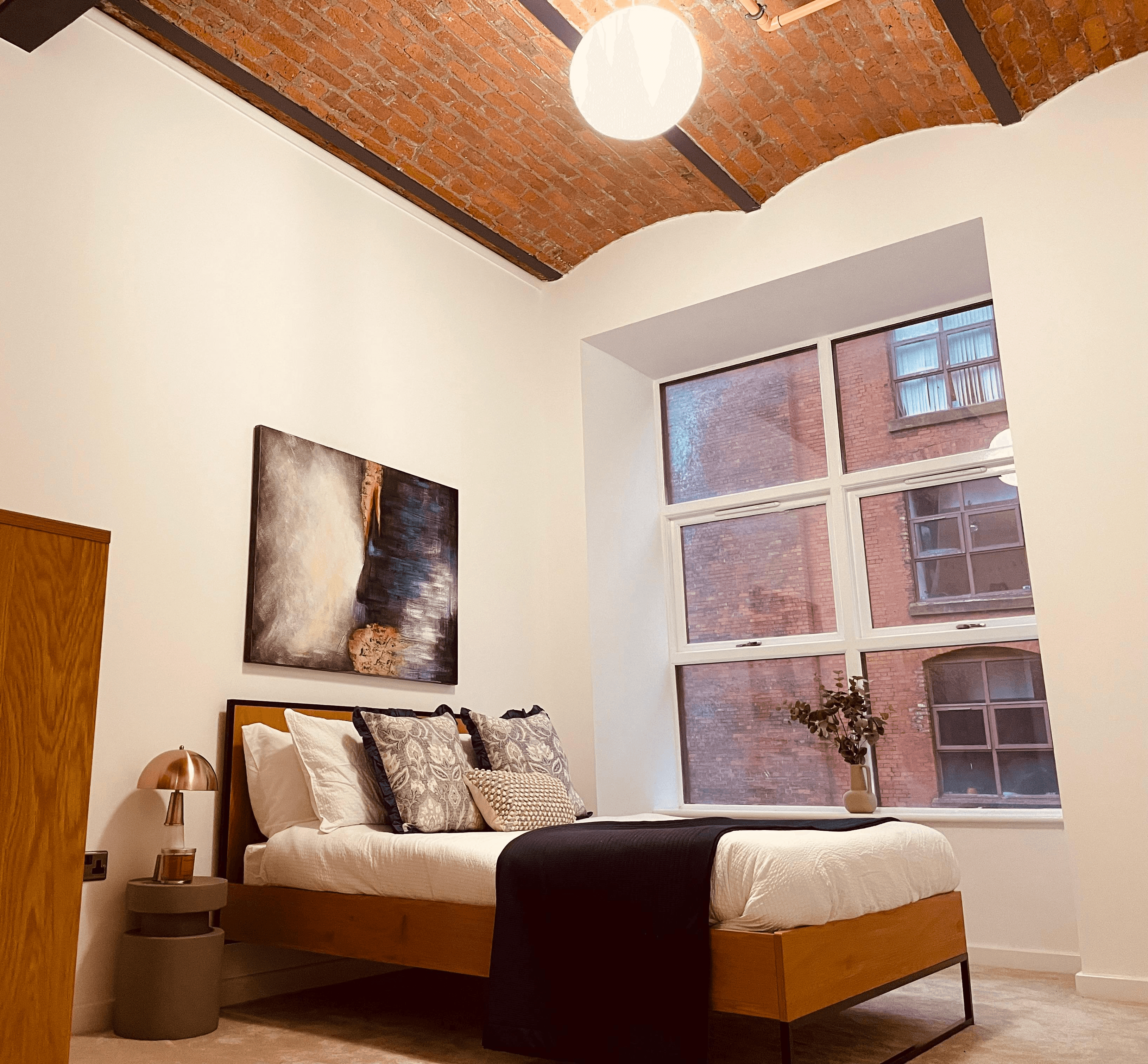 Bedroom with vaulted brick ceiling showcased in show flat by White Circle