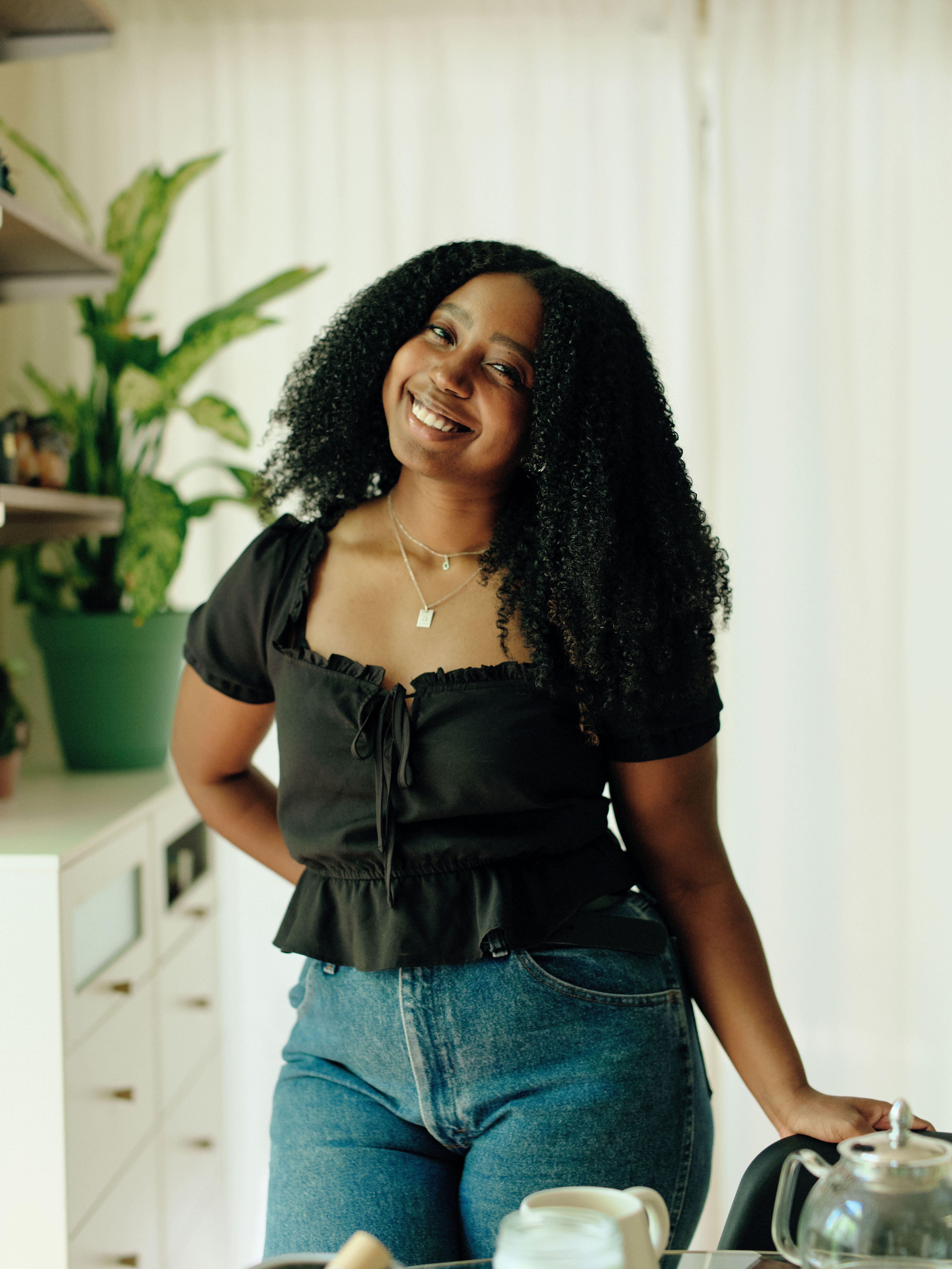 Person looking insecure in the mirror due to dental concerns.