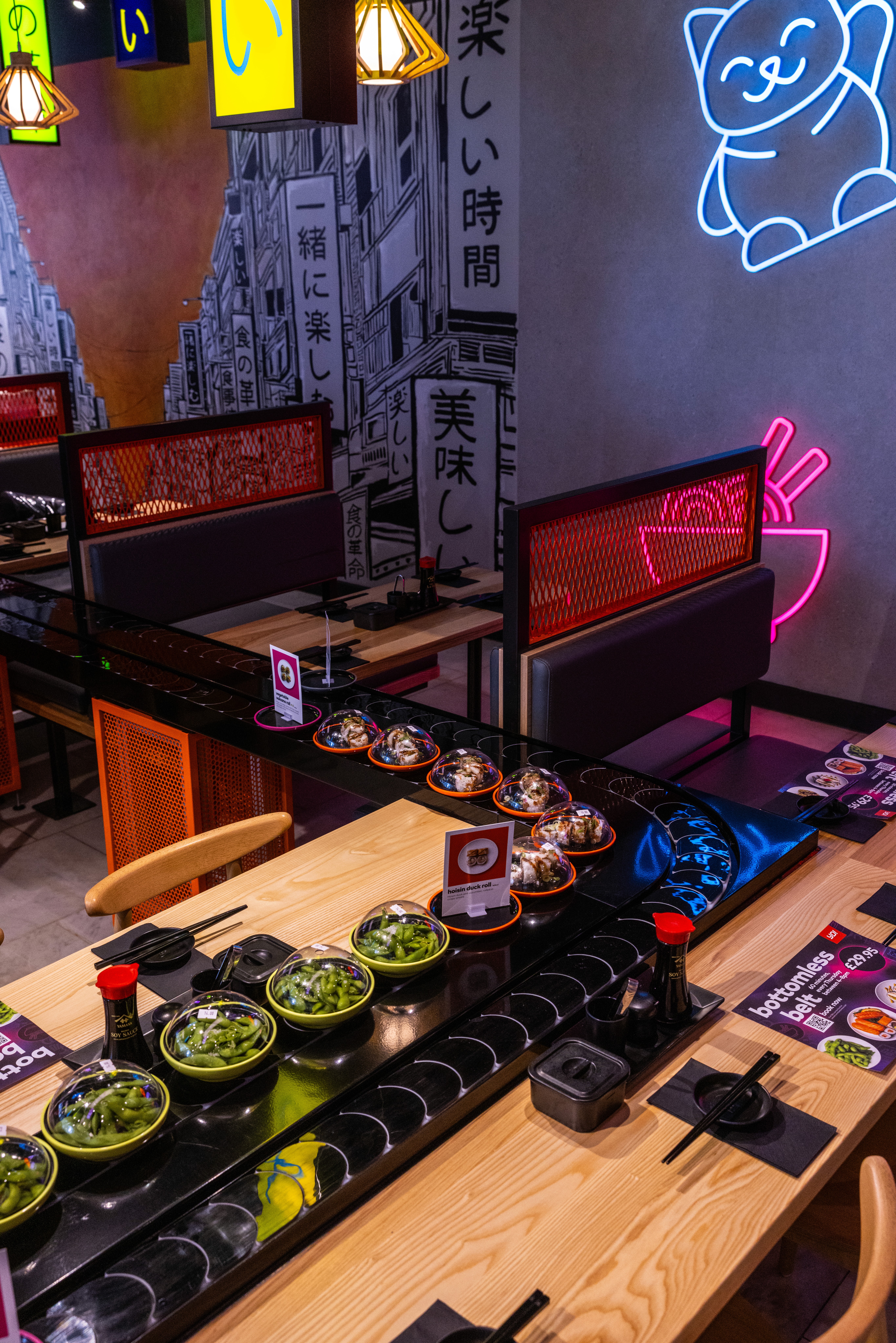 YO! Sushi restaurant fit-out at Westfield Stratford City with illuminated Stratford wall sign, booth seating and refreshed interior finishes