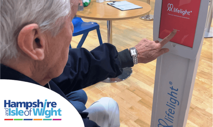 Older person using Lifelight on an ipad at a doctors office