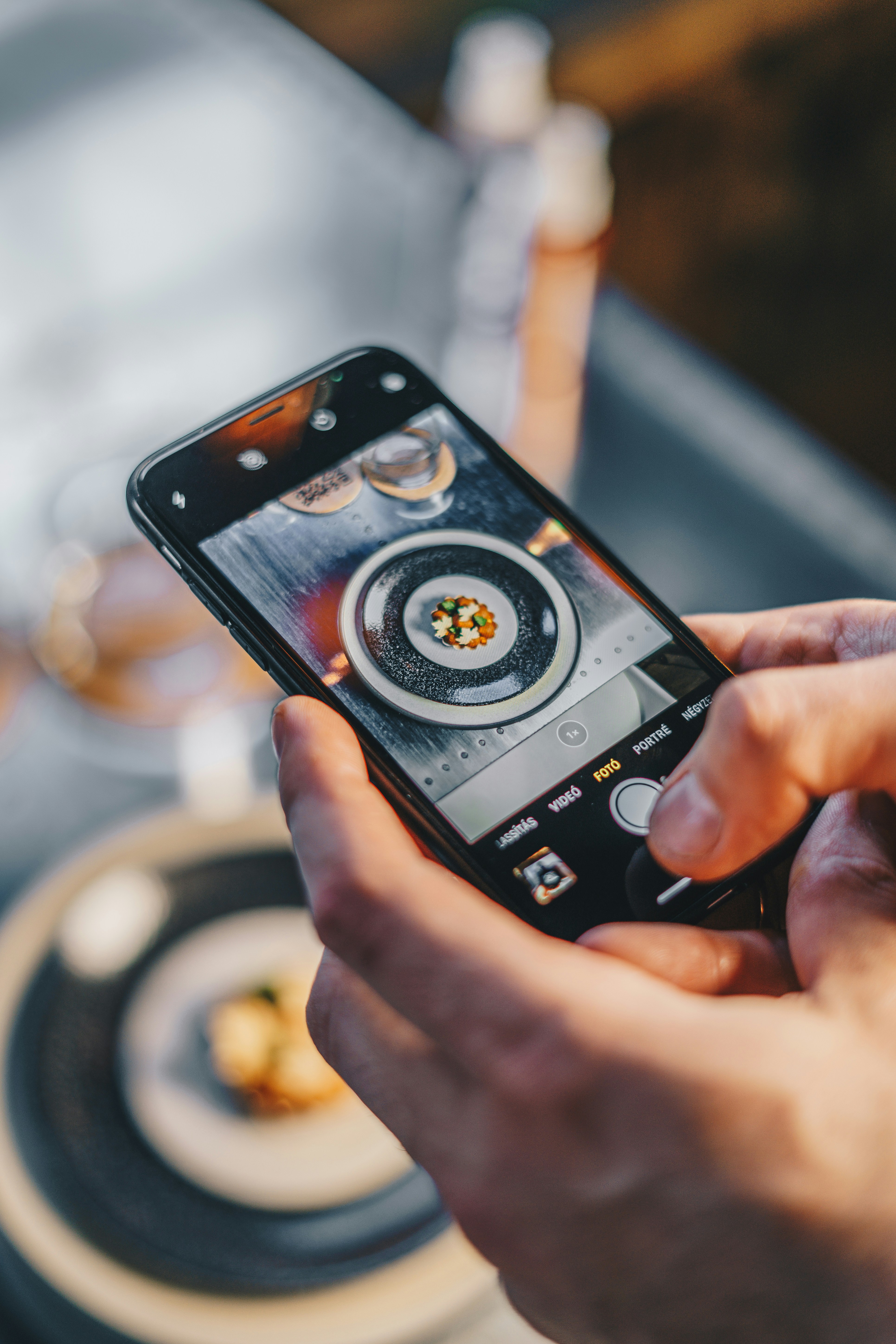 A person taking a photo of their meal to save it.