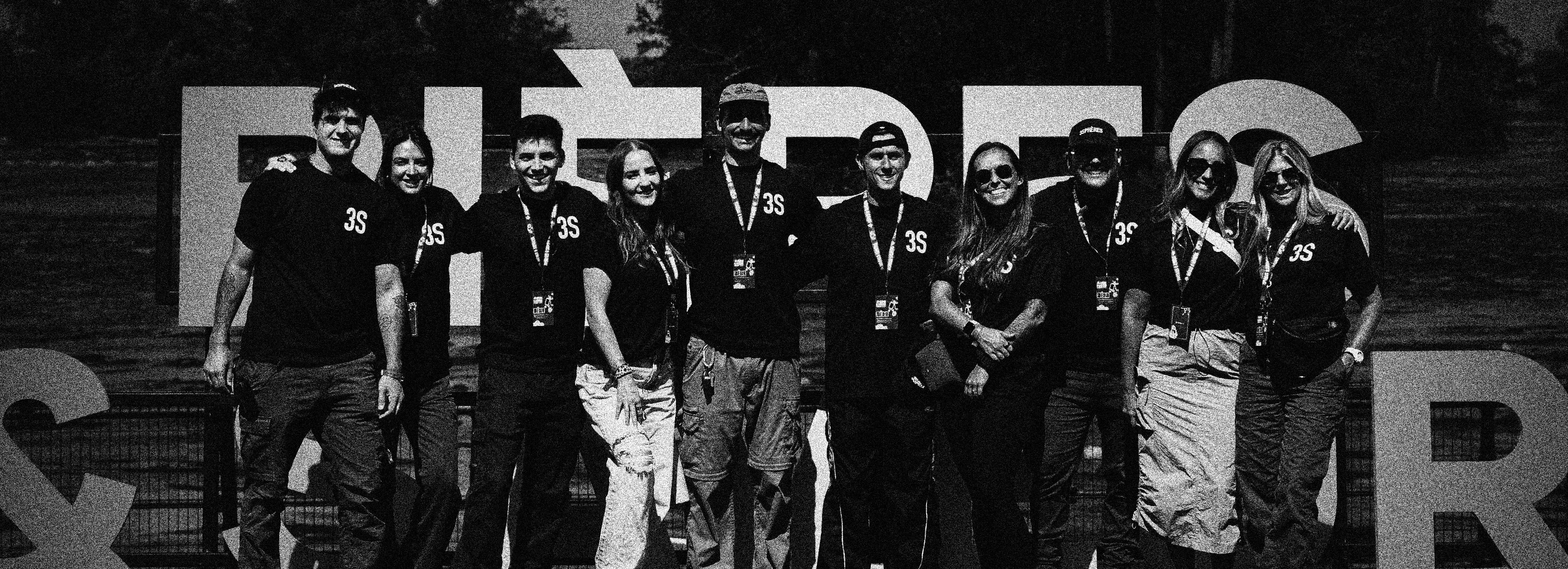 People celebrating, red stickers floating in the air