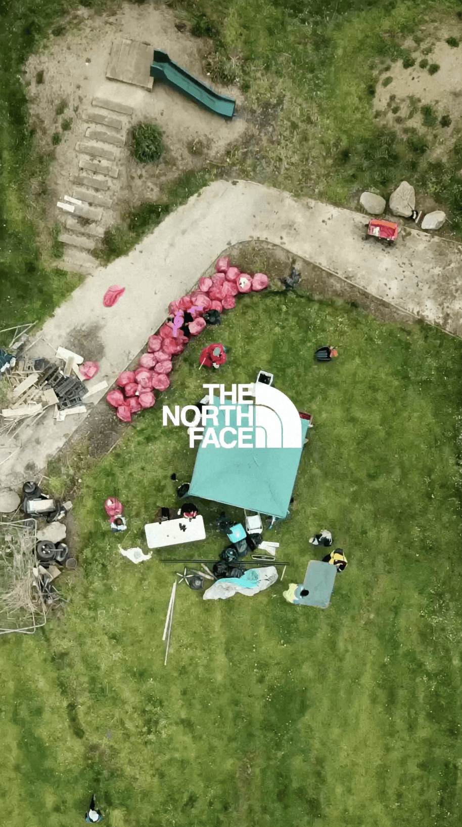 Couple embracing on street, bride's face obscured