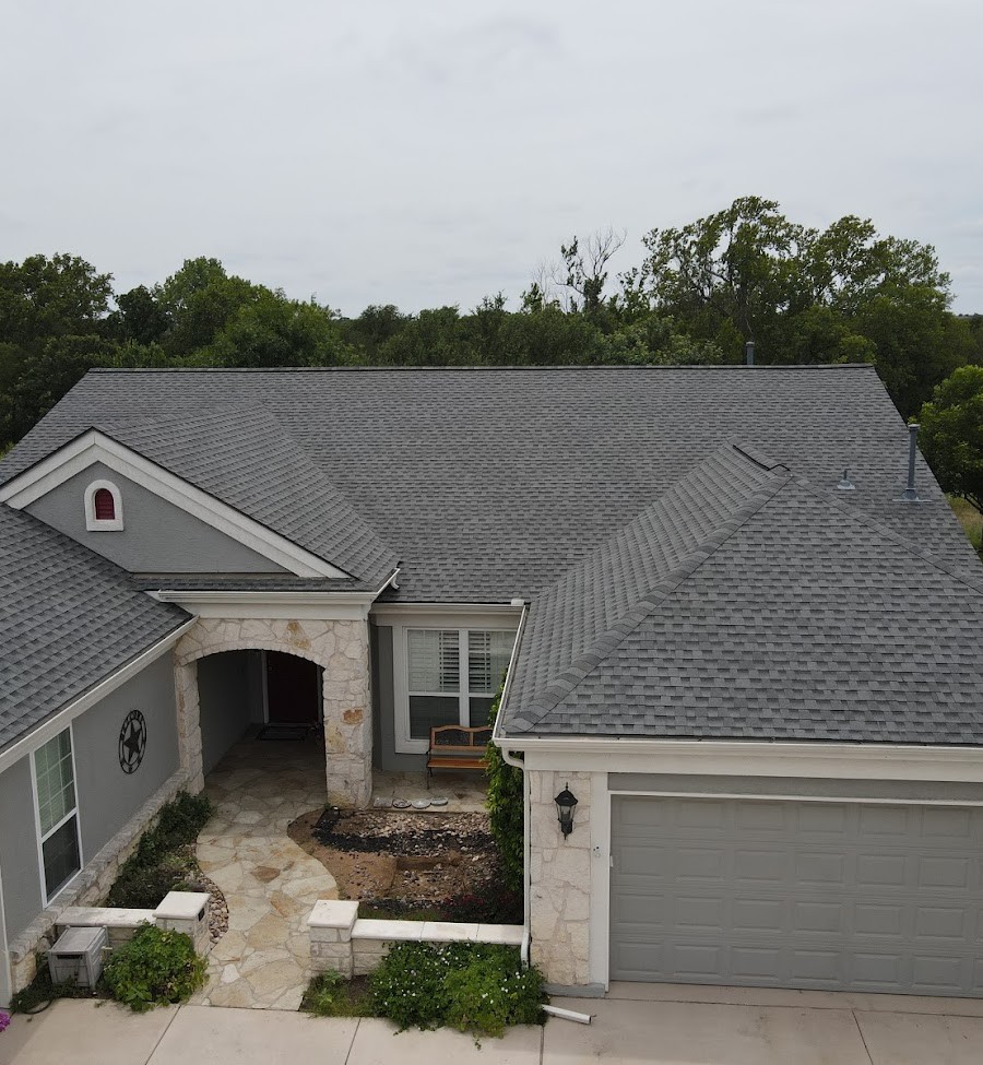 Stone house in San Antonio with GAF HDZ Shingles and ridge vent.