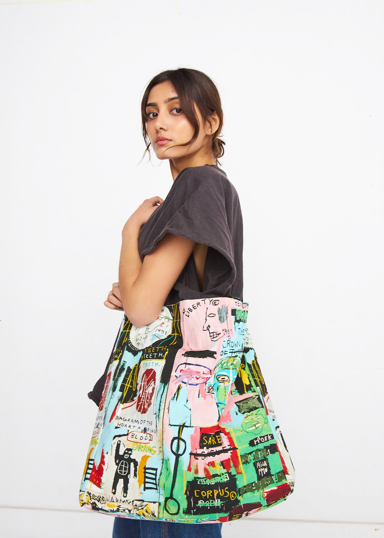 Woman walking on a curved pavement with shadow.