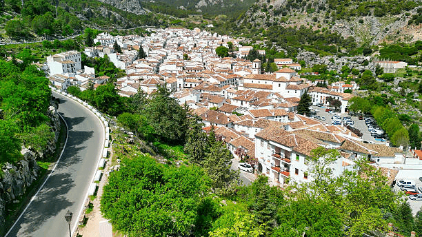 Grazalema white village surrounded by lush hills in Andalusia