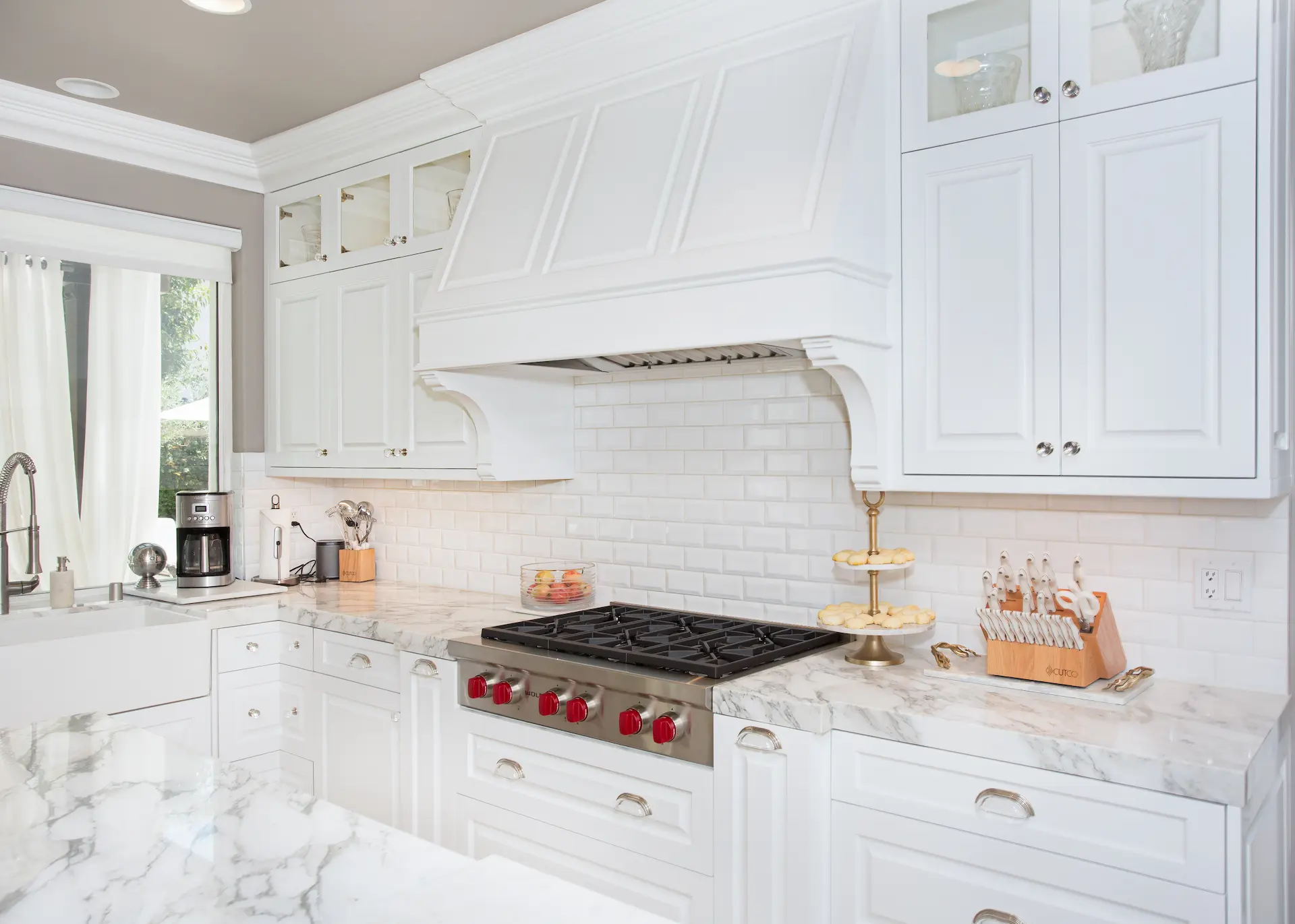 'Newport Beach Remodel' shows a white kitchen with marble countertops and a subway tile backsplash.