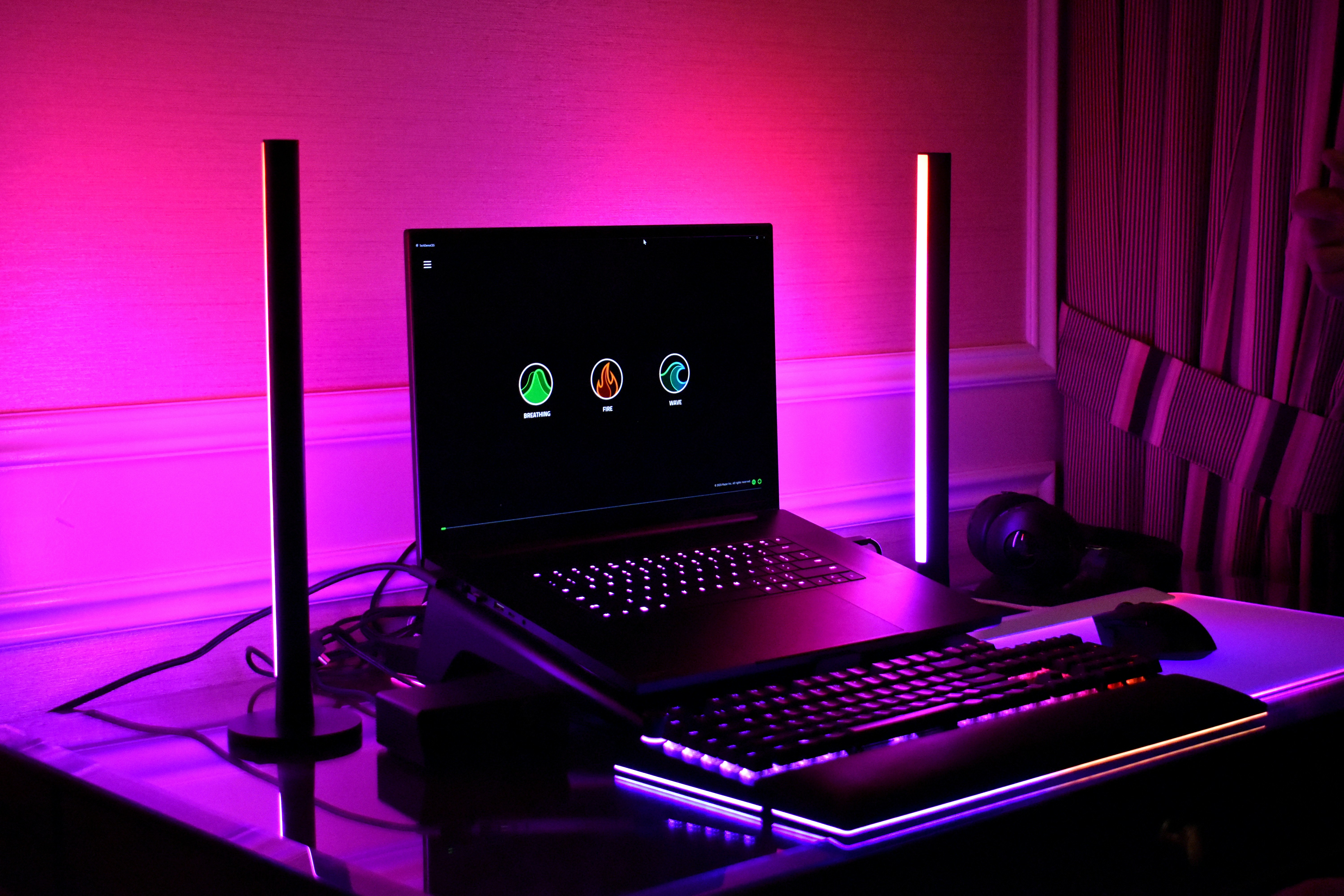 RGB gaming laptop setup with keyboard and lighting