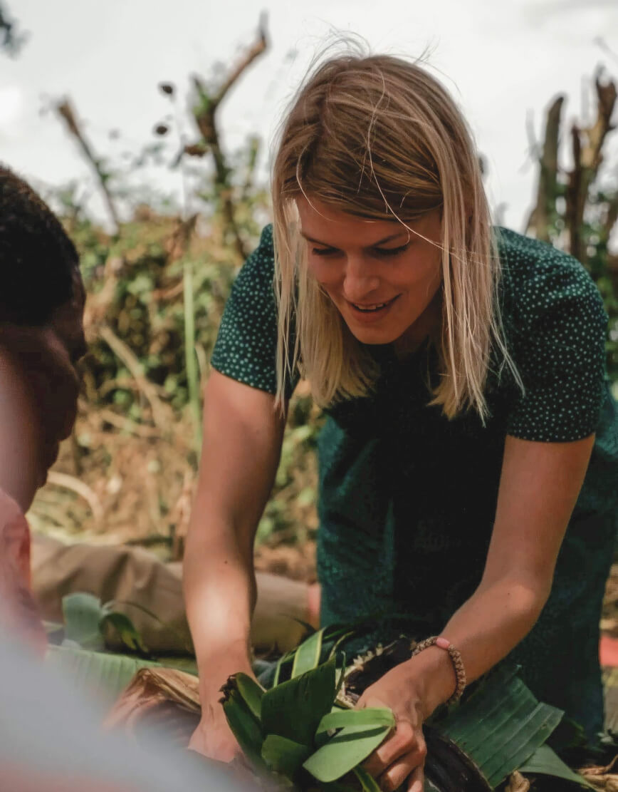 One of Mary's guests learning skills from the locals