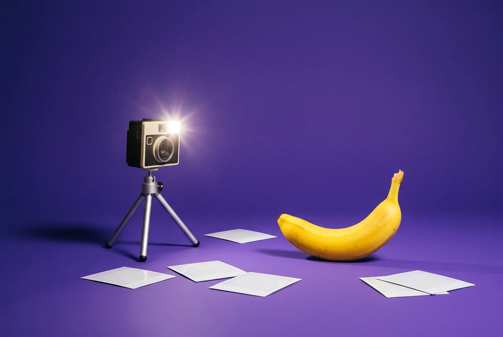 A banana posing for a vintage instant camera with blank prints on the floor, a Covenant Eyes review for QUITTR vs Covenant Eyes