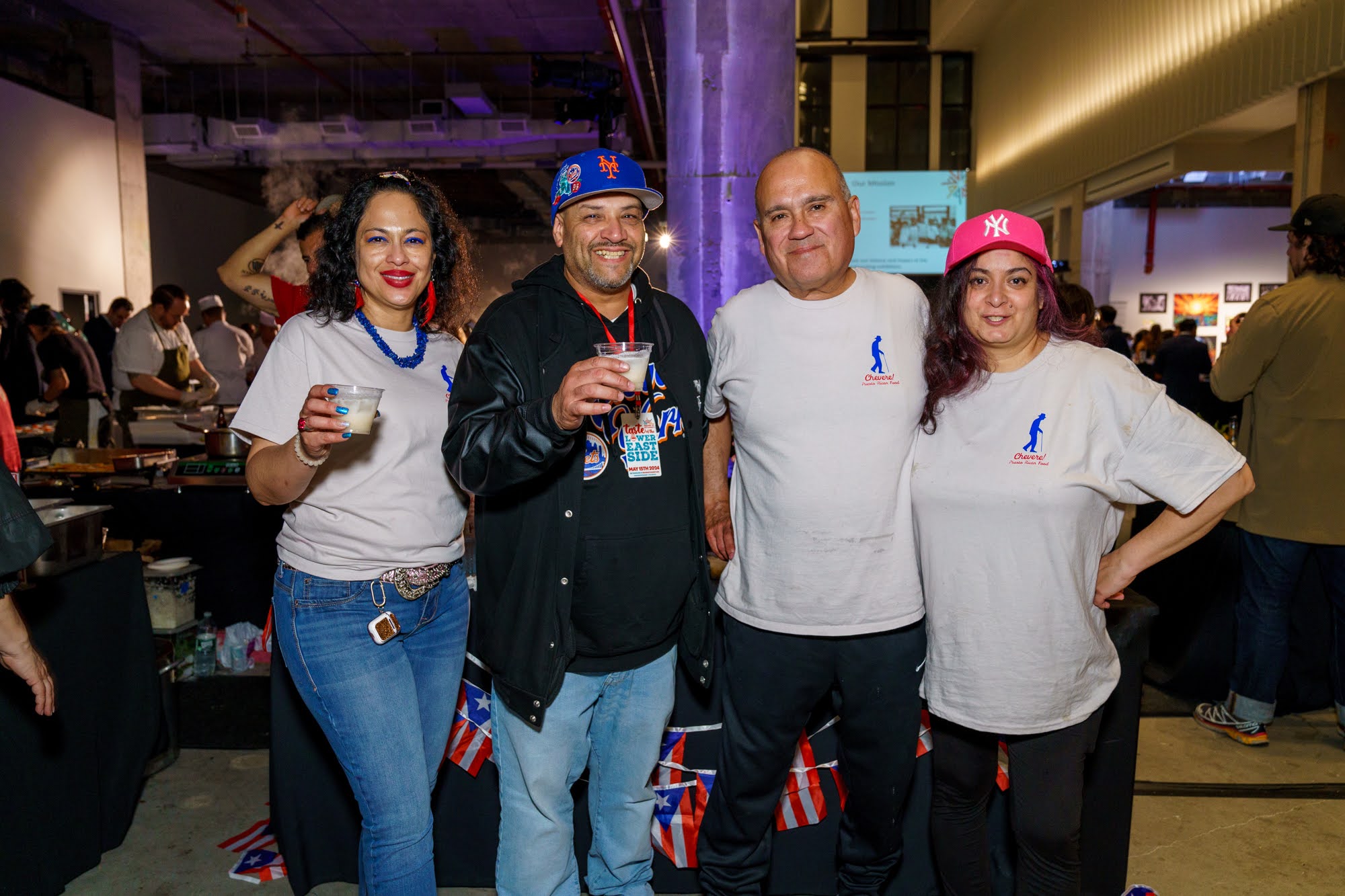 Staff members from Chevere restaurant pose for a photo during an event.