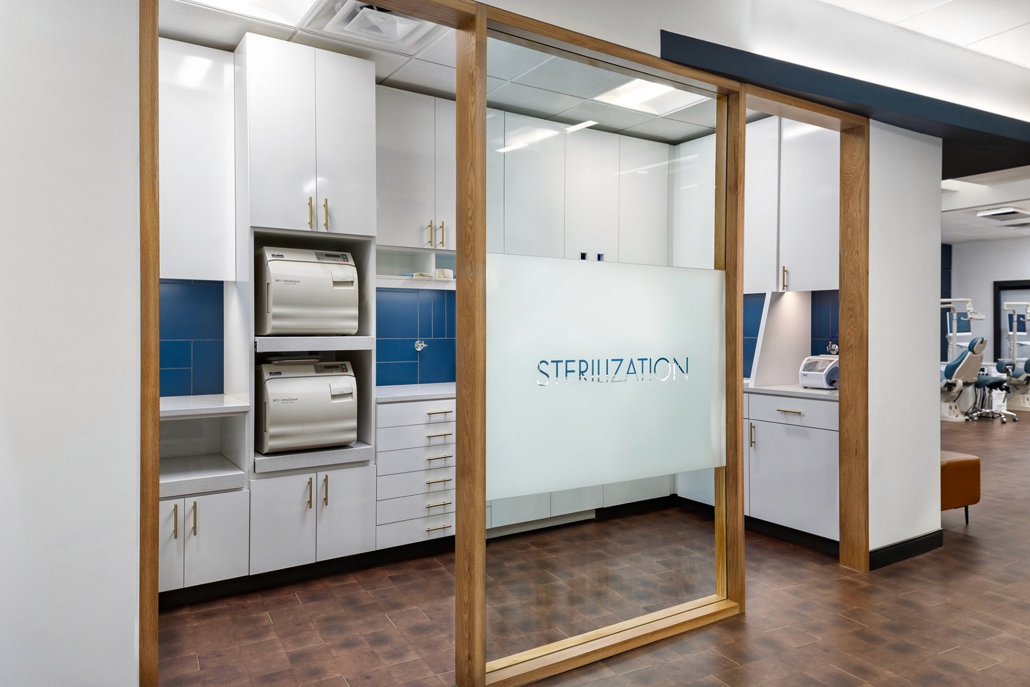 A modern interior space featuring a large wooden frame, light-colored walls, and display panels.