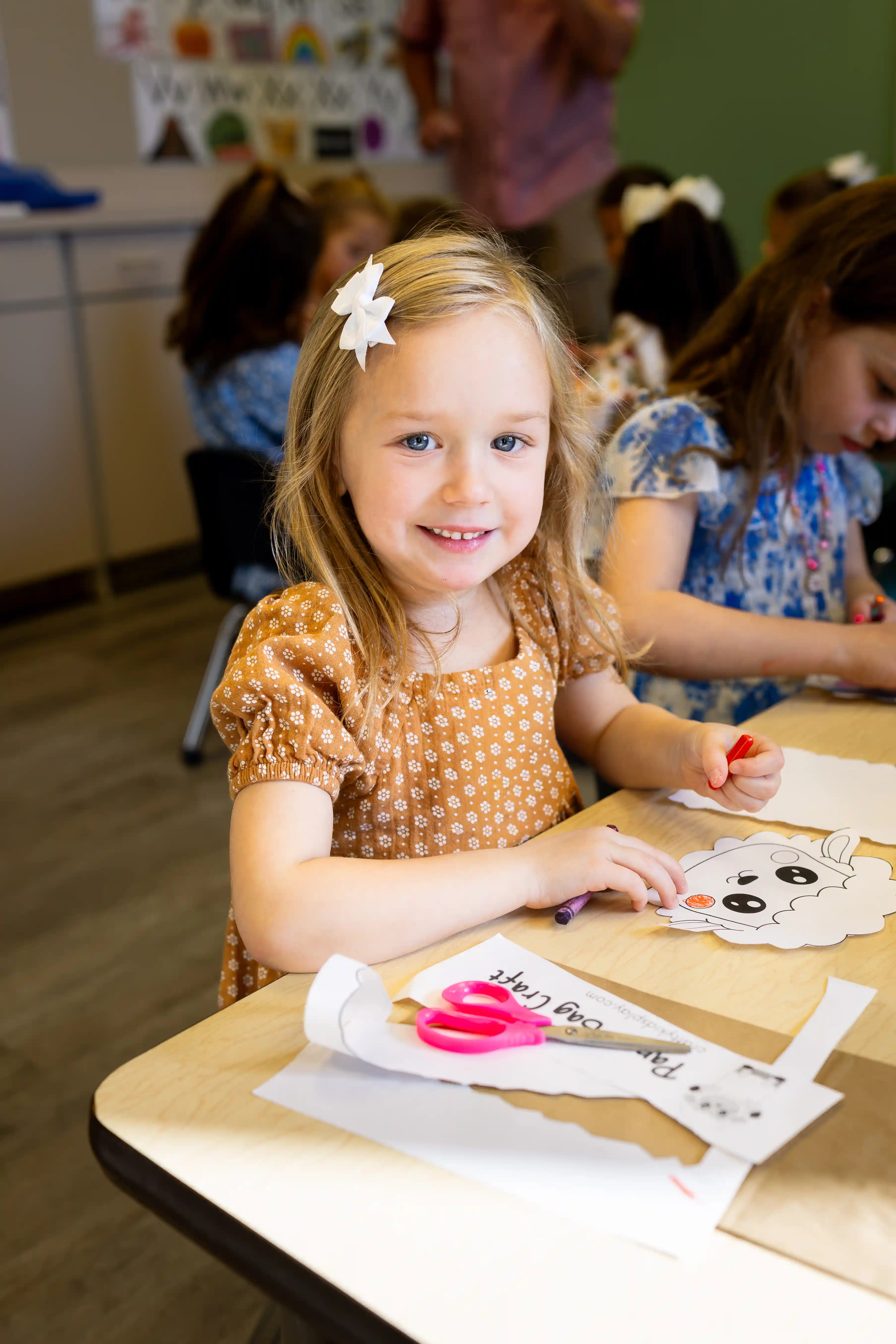 Toddler Girl smiling during craft time
