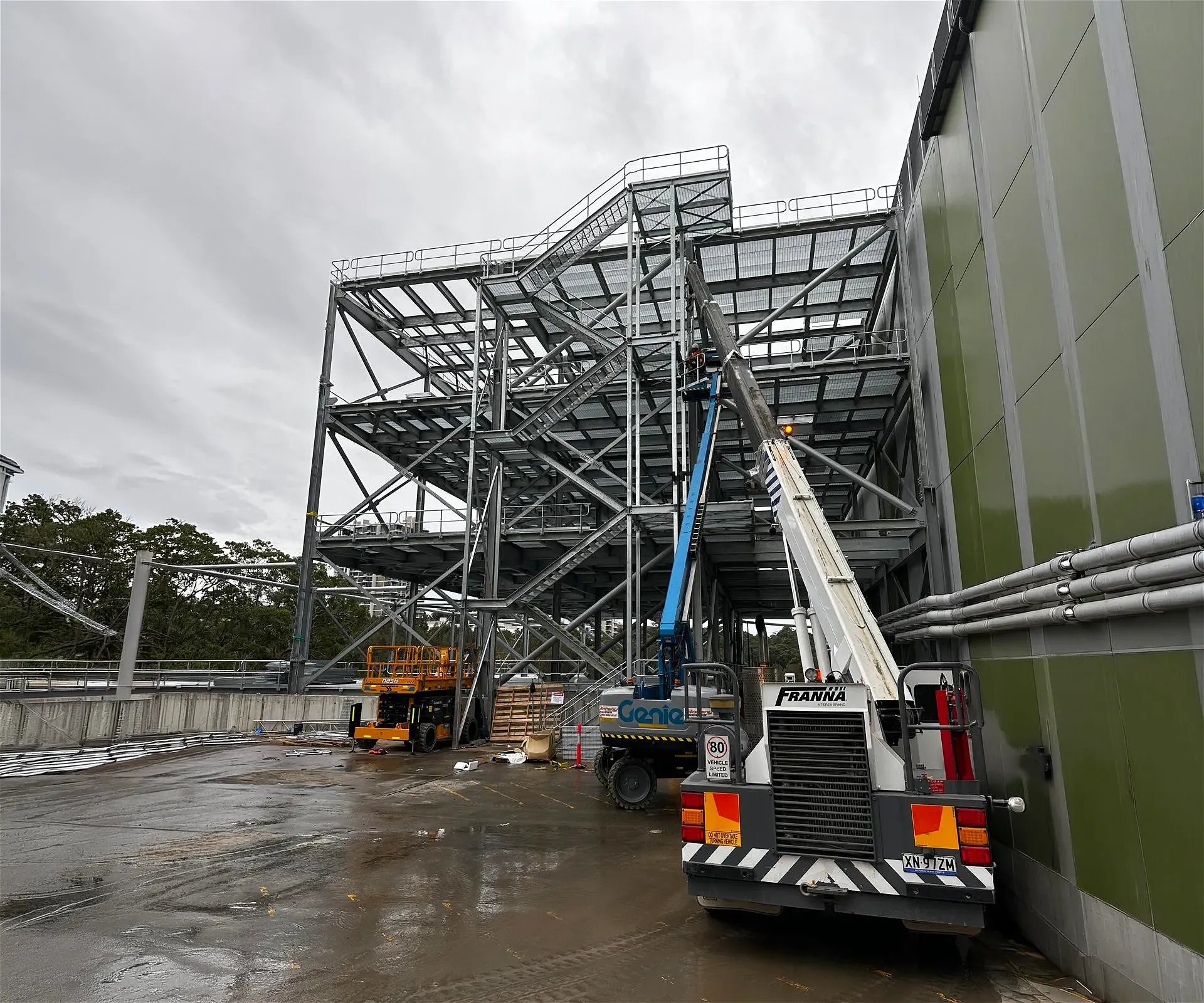 Steel structure with cranes and lifts for construction
