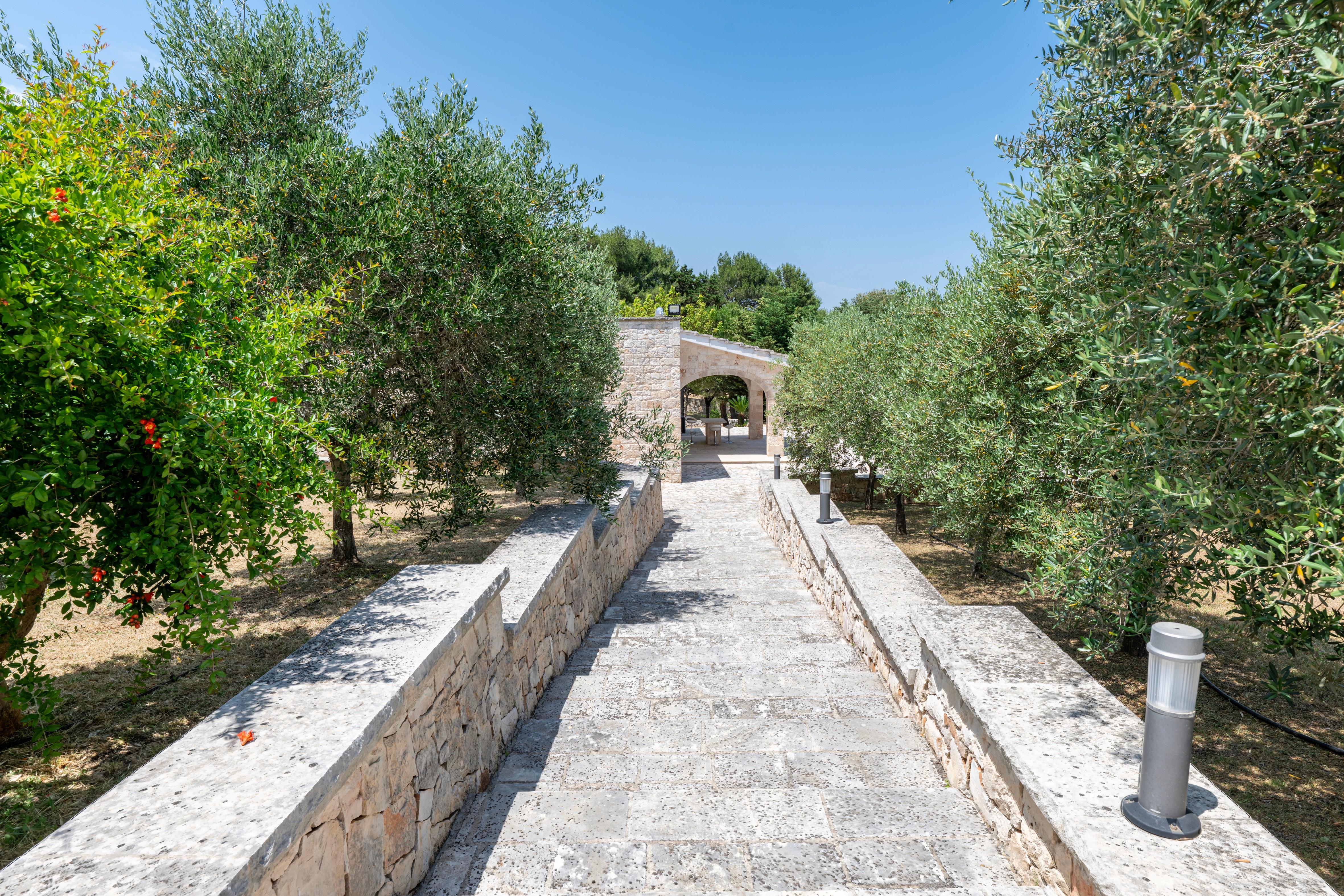 Elevated house with glass railings and scenic views