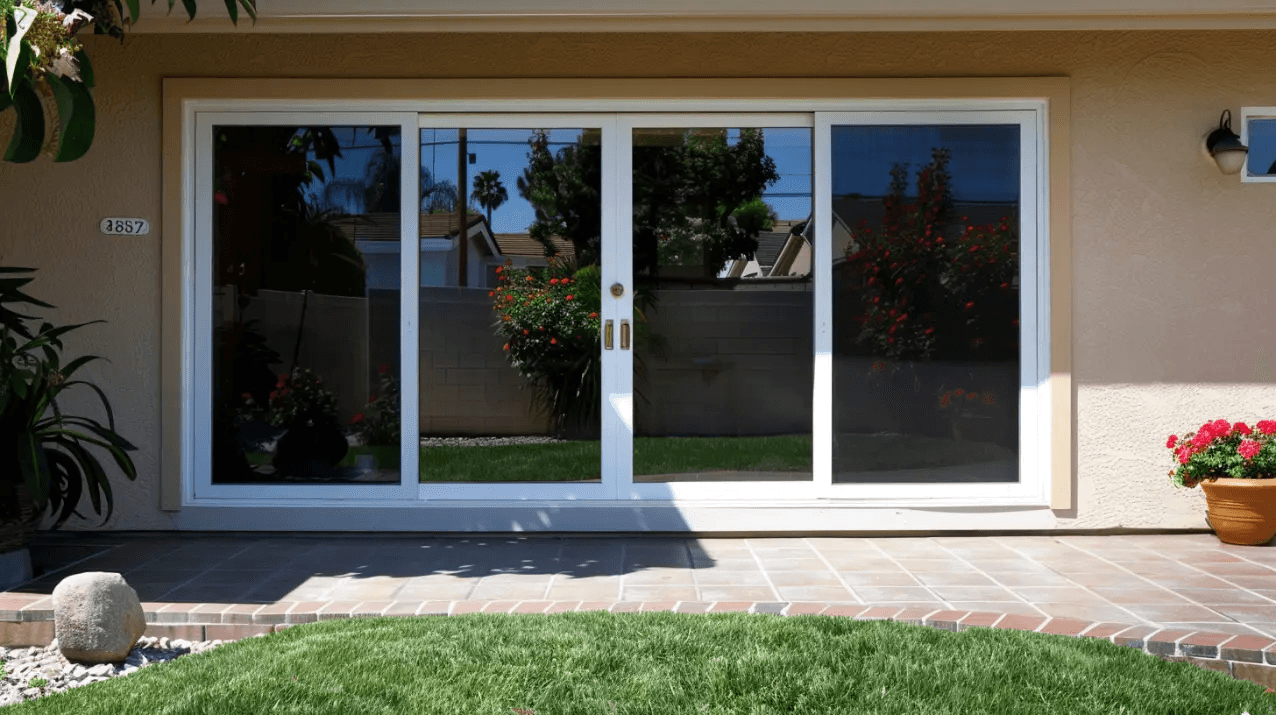 standard-four-panel-sliding-glass-door-in-stucco-wall