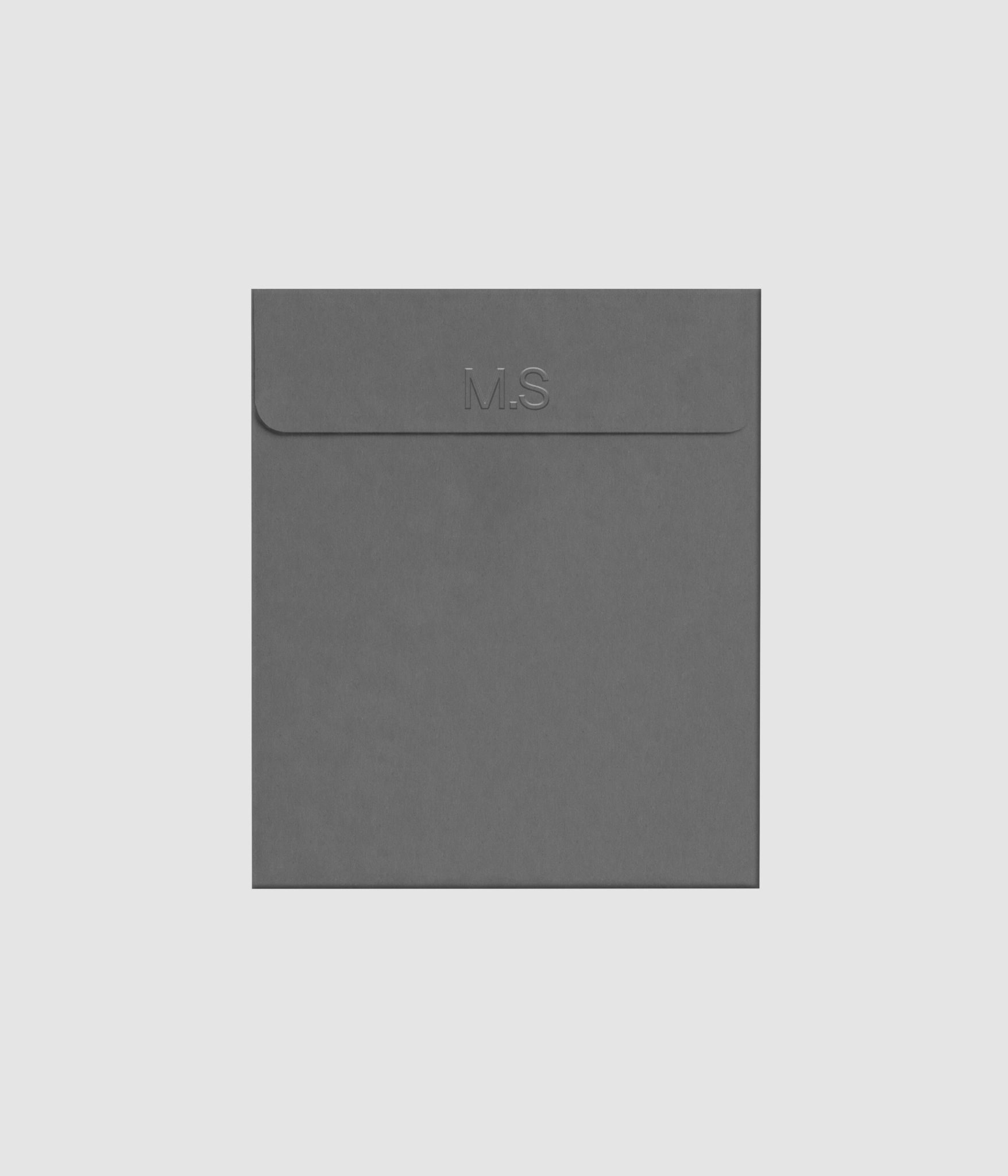 Gray envelope mockup featuring embossed letterpress logo effect on Mockups Supply